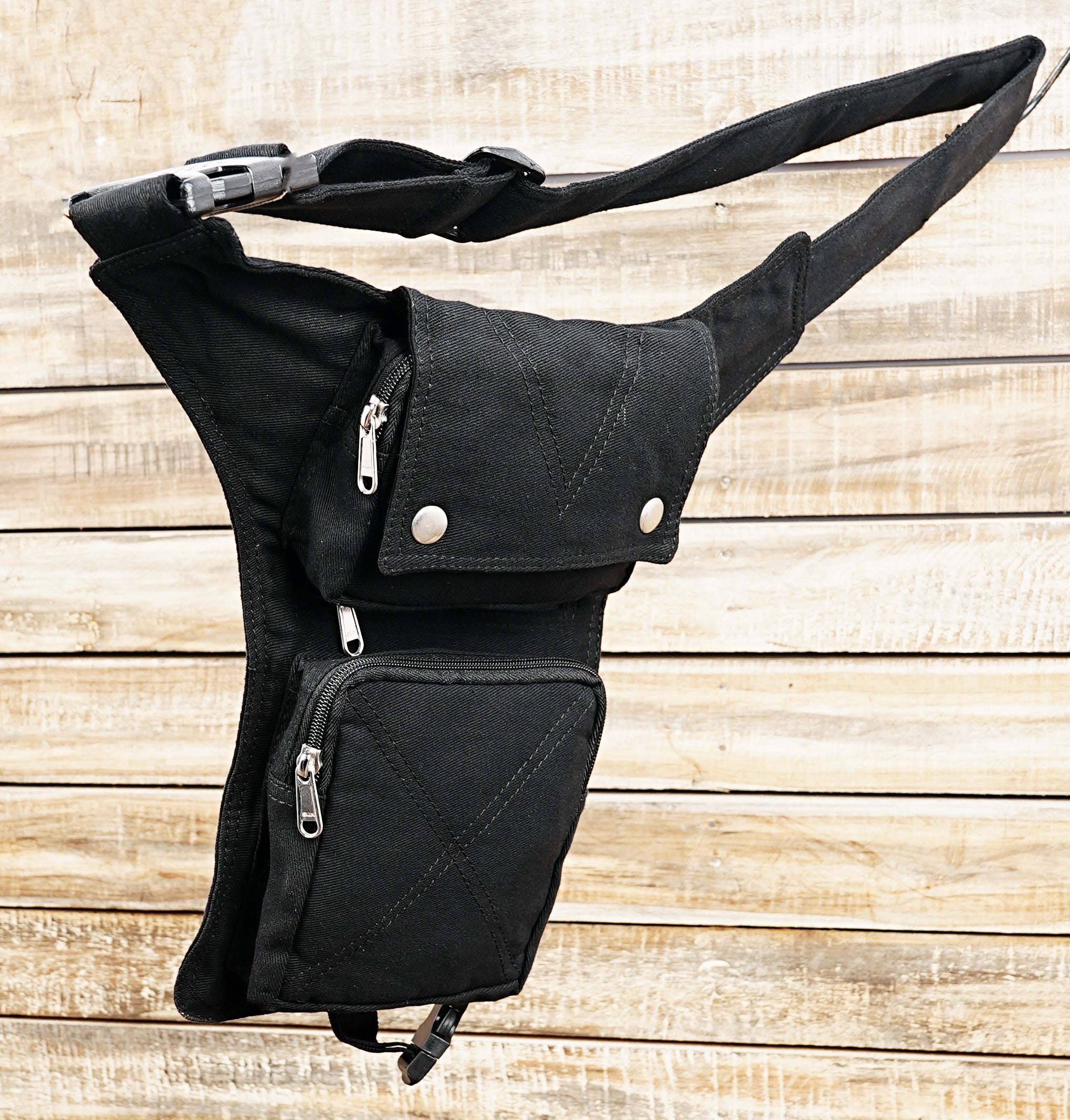 Black utility waist bag with thigh strap and pockets