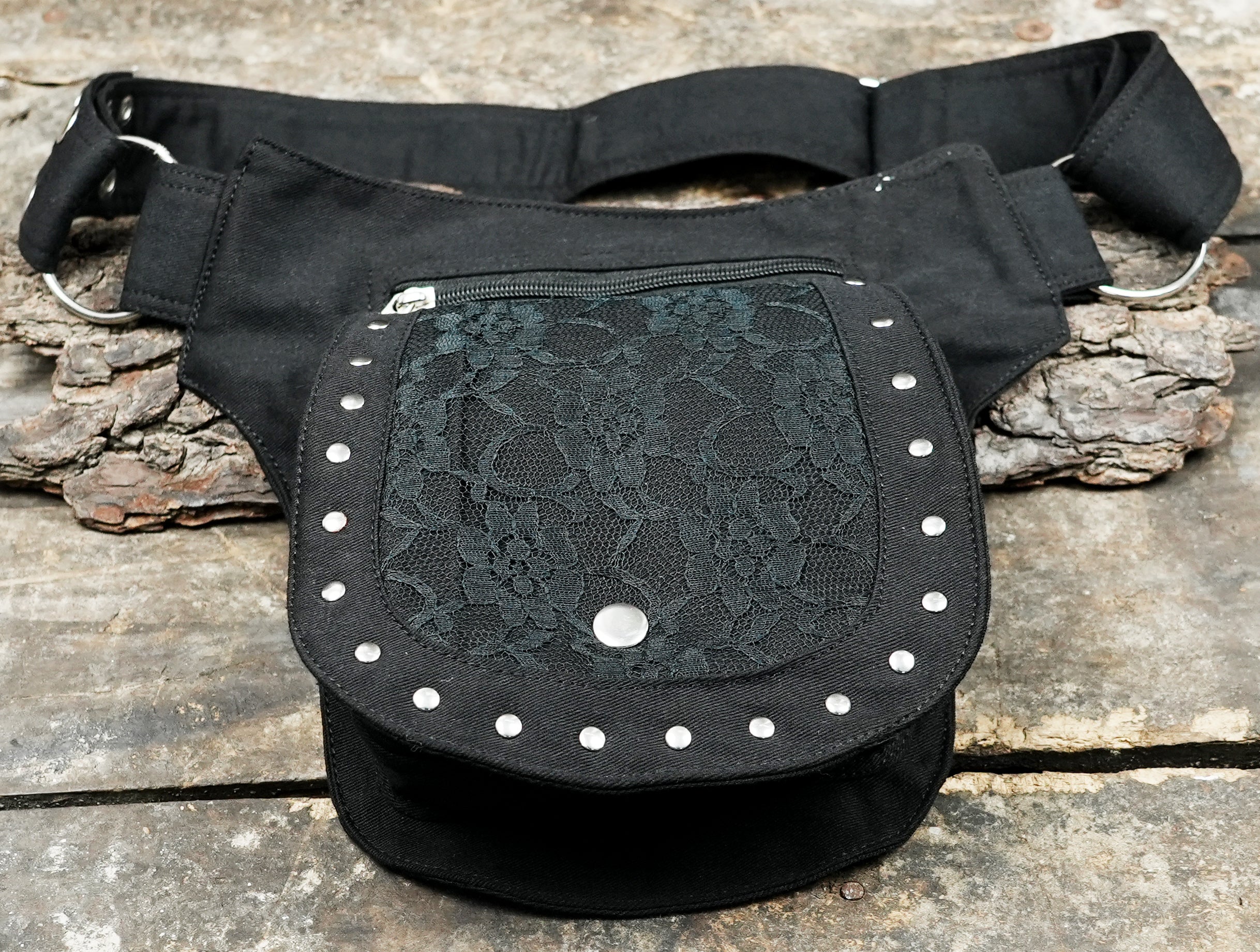 Multi-functional black canvas utility belt for a modern, functional streetwear outfit.