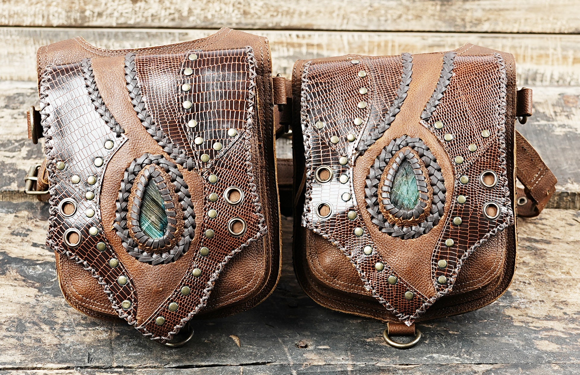 “Handmade leather holster featuring snakeskin-style texture and gemstone design”