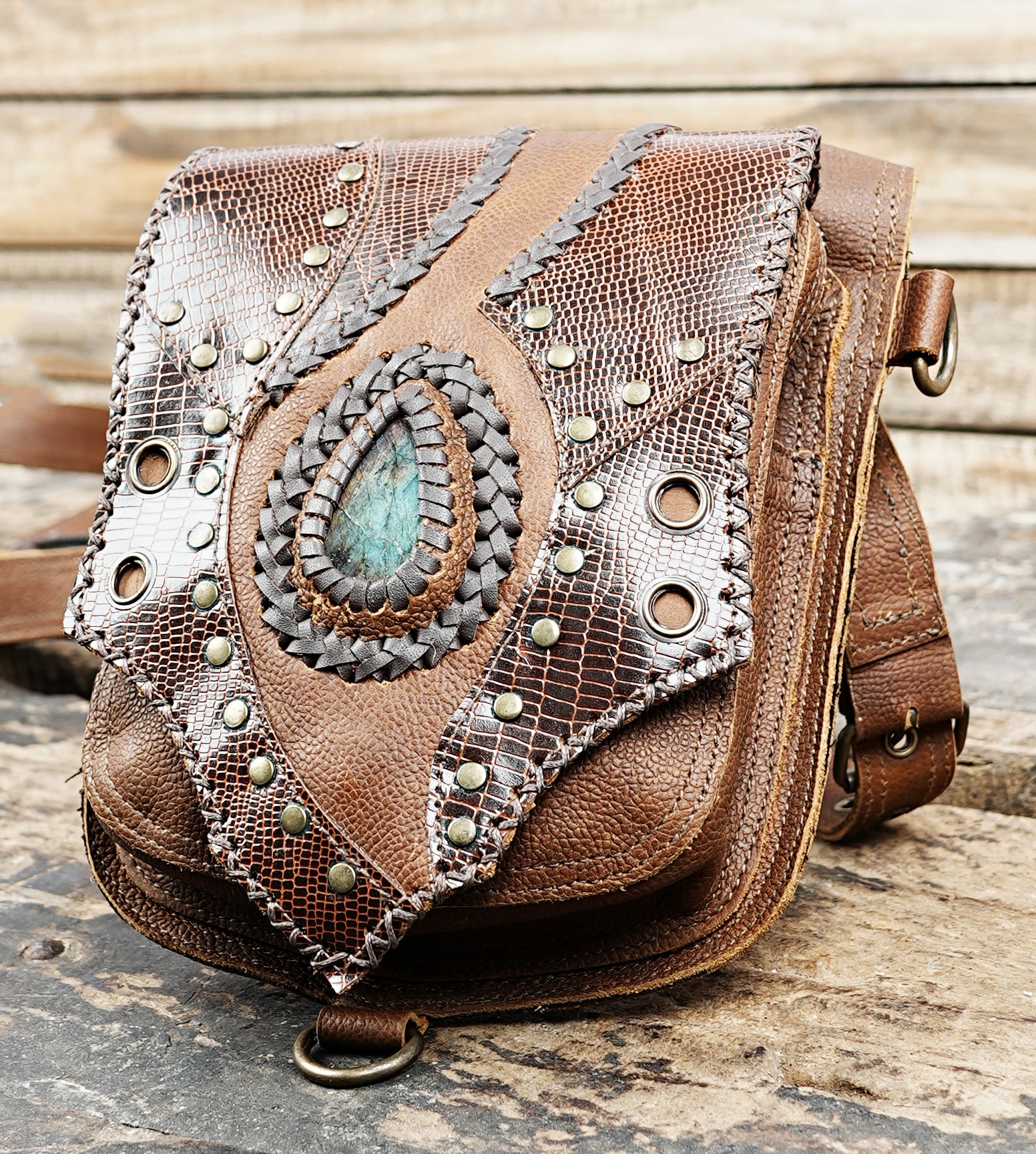 “Rustic leather holster belt with double pouches and natural stone inlays”