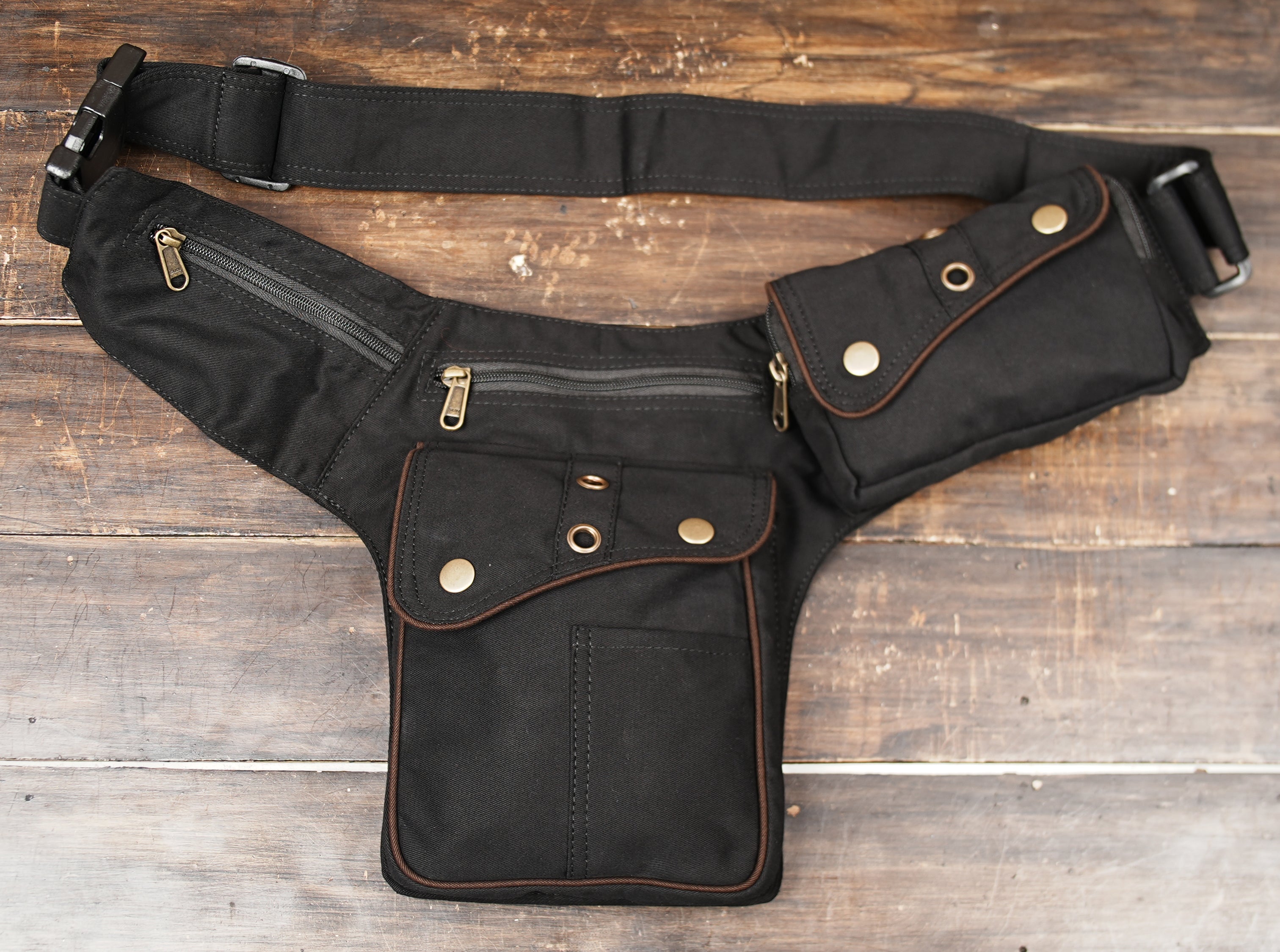 Utility hip pack with zippered compartments and snap pocket