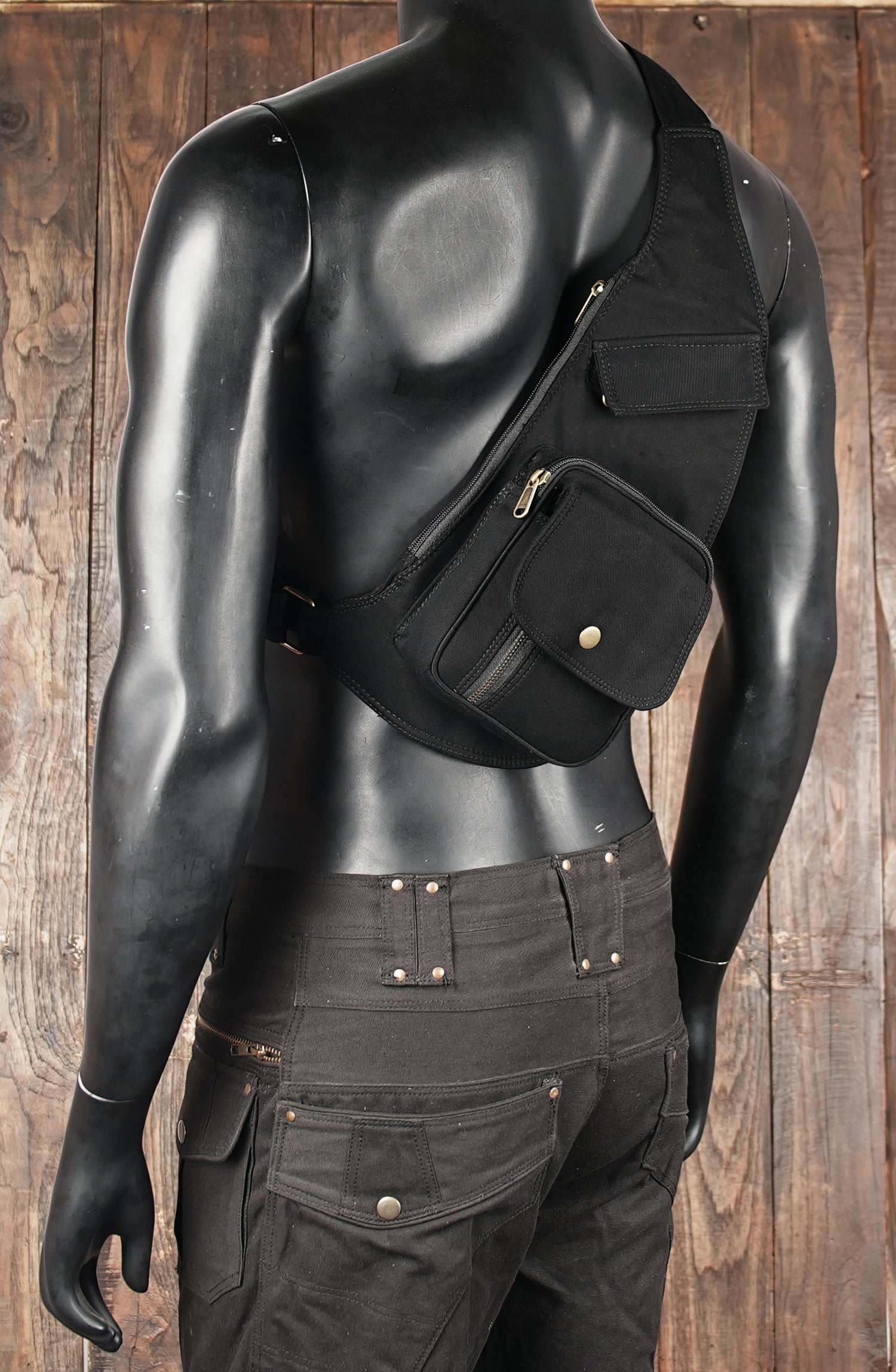 Black cotton festival holster bag with slim design and metal button detail