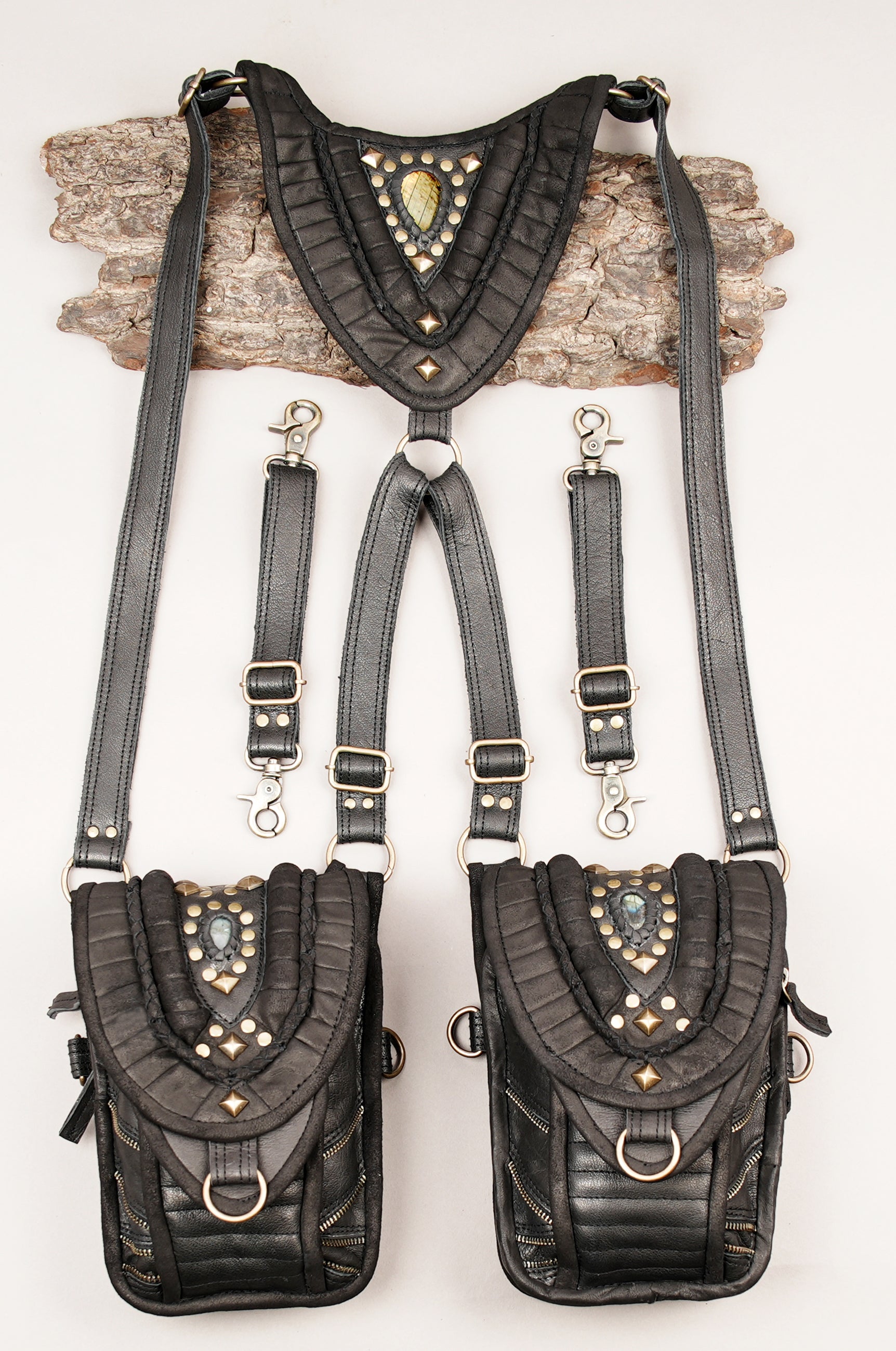 “Artisan cream leather shoulder rig with layered flap and stone inlay”