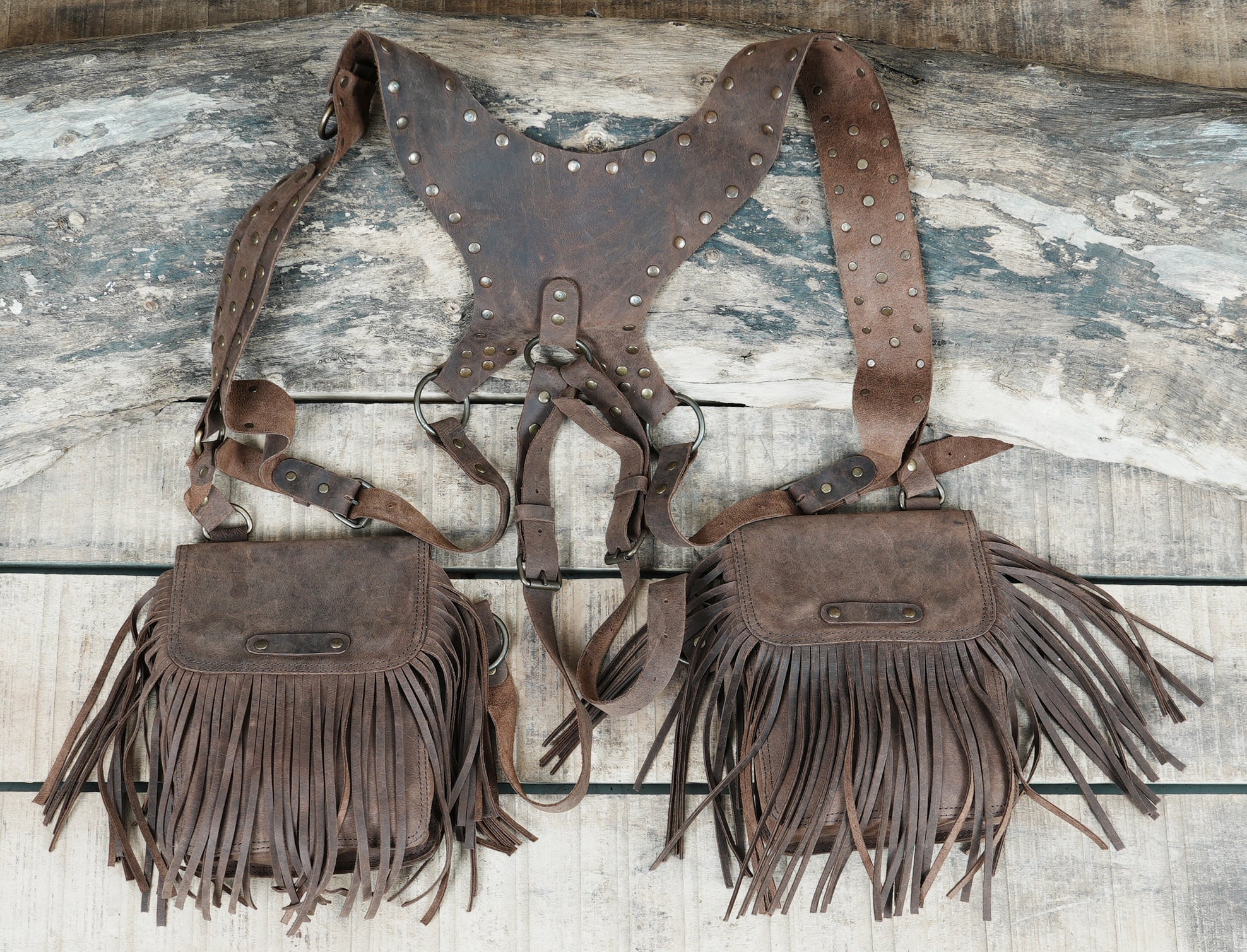 Statement leather holster bag with rugged fringe design