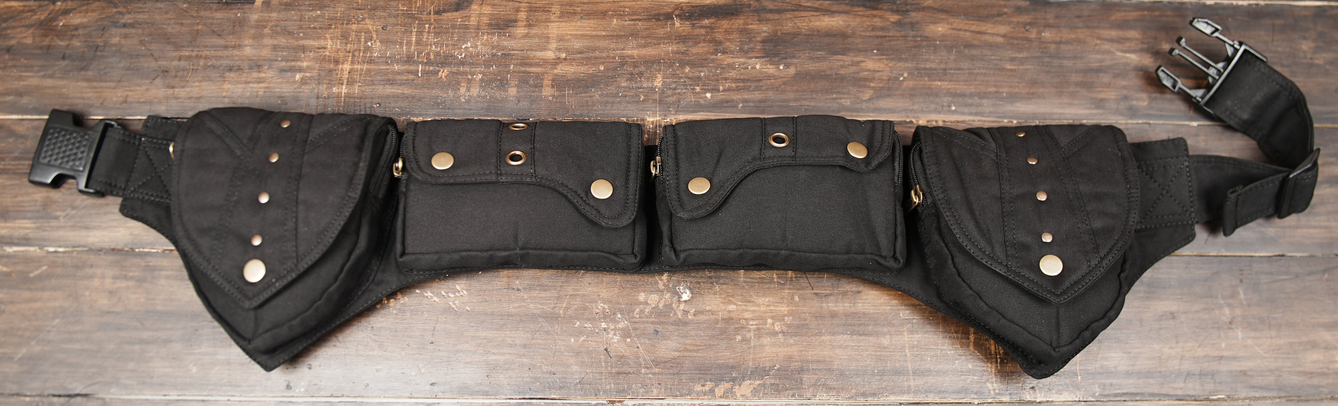 Unisex utility belt bag with four storage pouches and buckle closure
