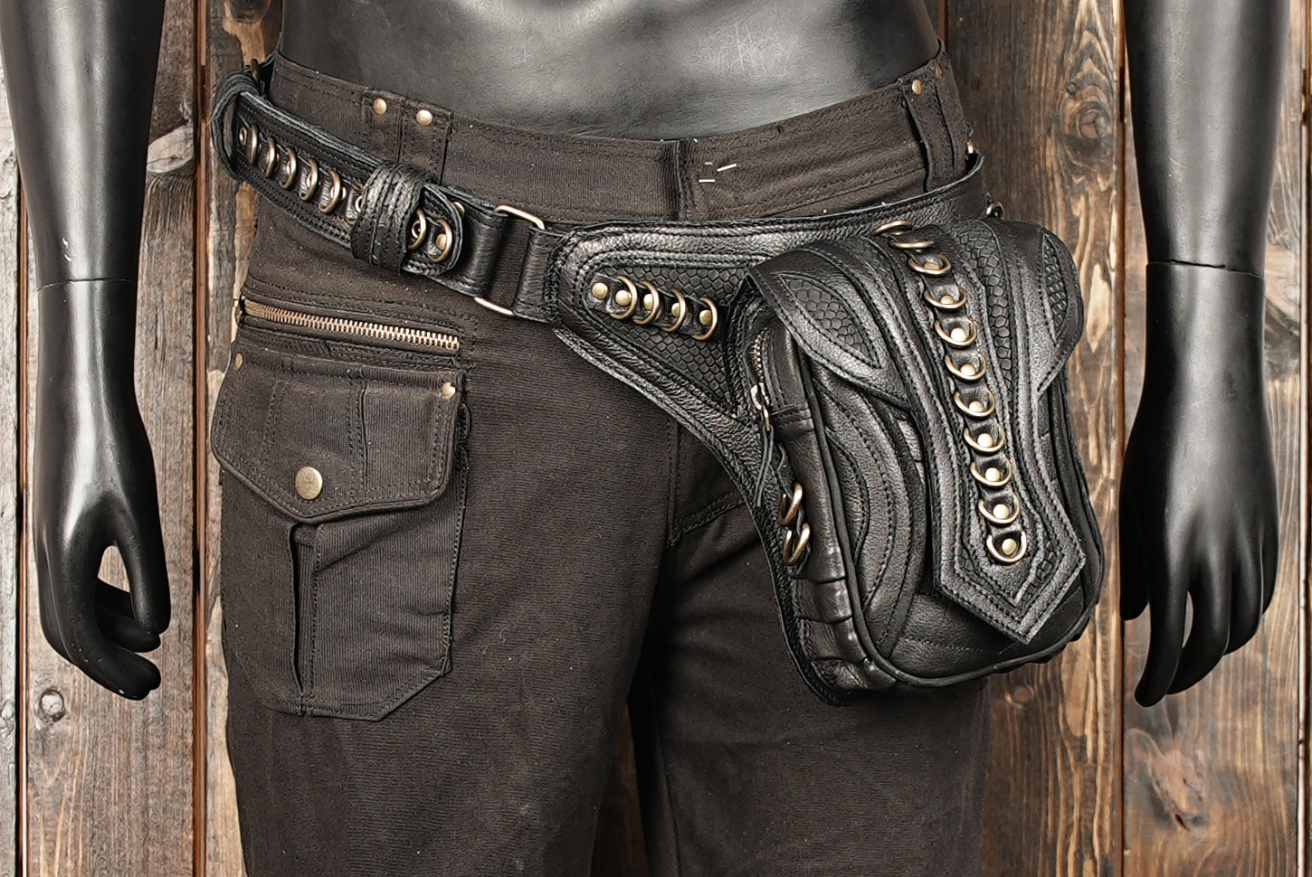 Artistic photo of black Western belt bag with steampunk detailing