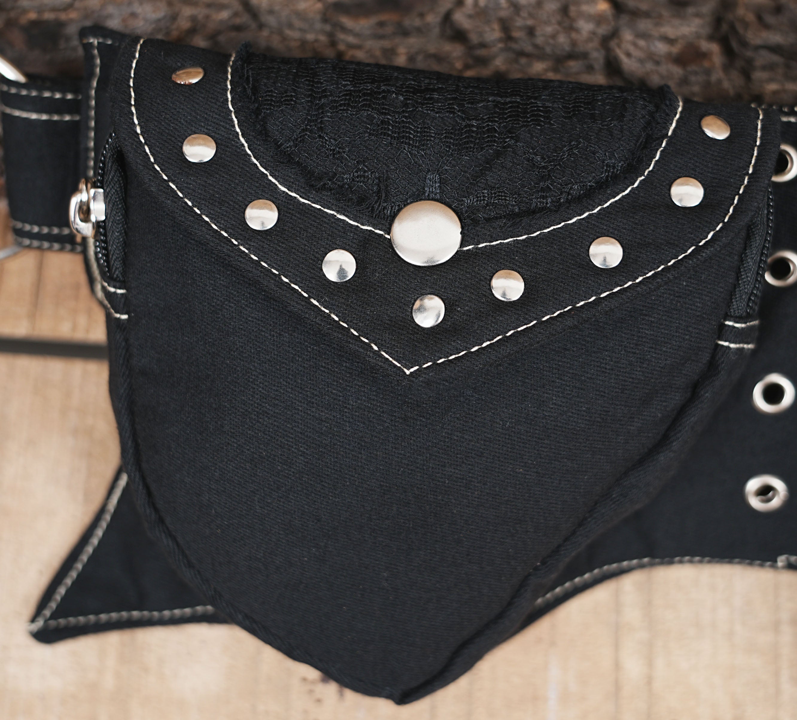 Double-pouch utility fanny pack in black canvas, ideal for festivals or hands-free travel.