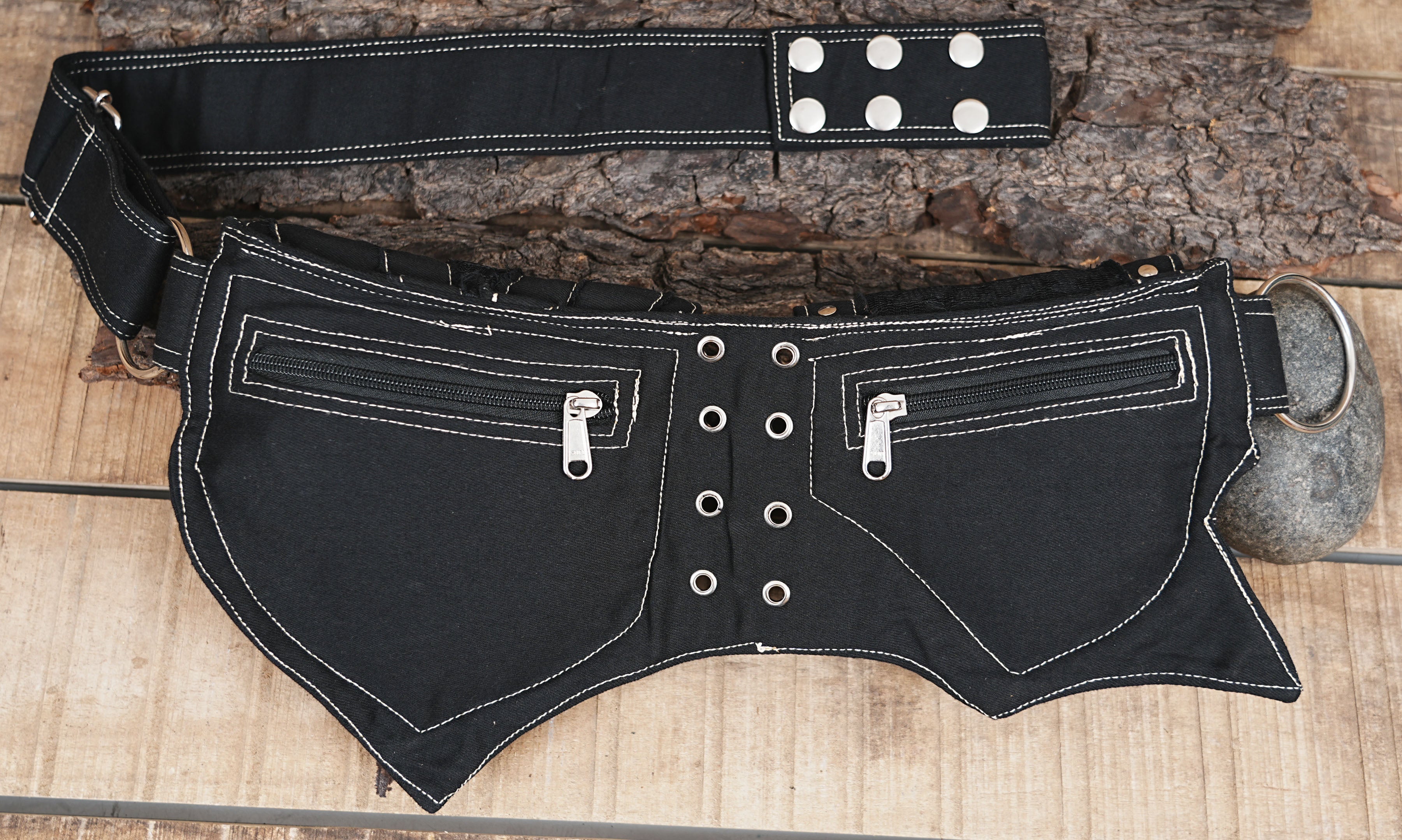 Festival-ready black cotton bum bag featuring segmented pouches and reflective stitching.