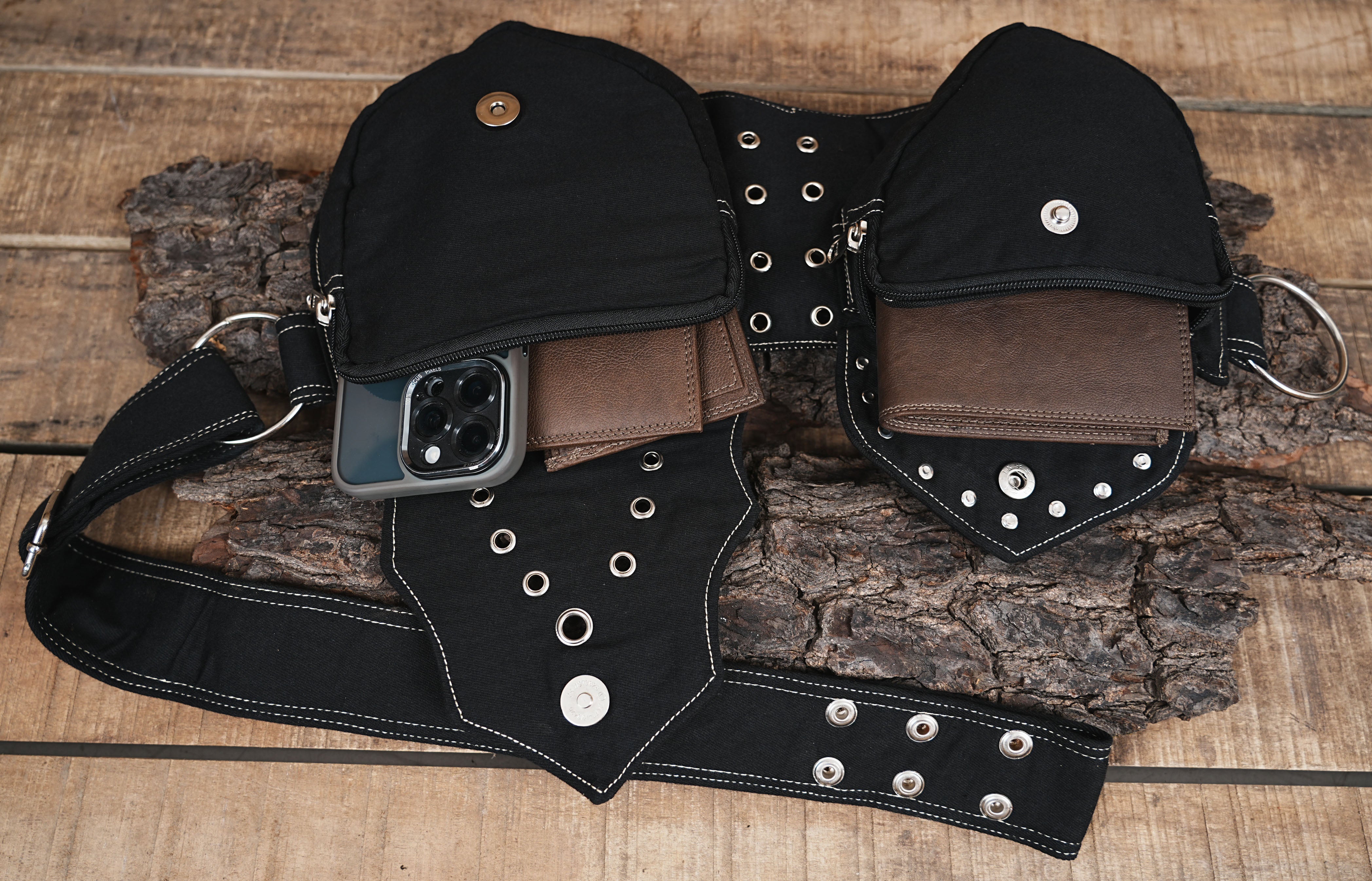 Practical black utility waist belt with segmented pouches for organized storage.