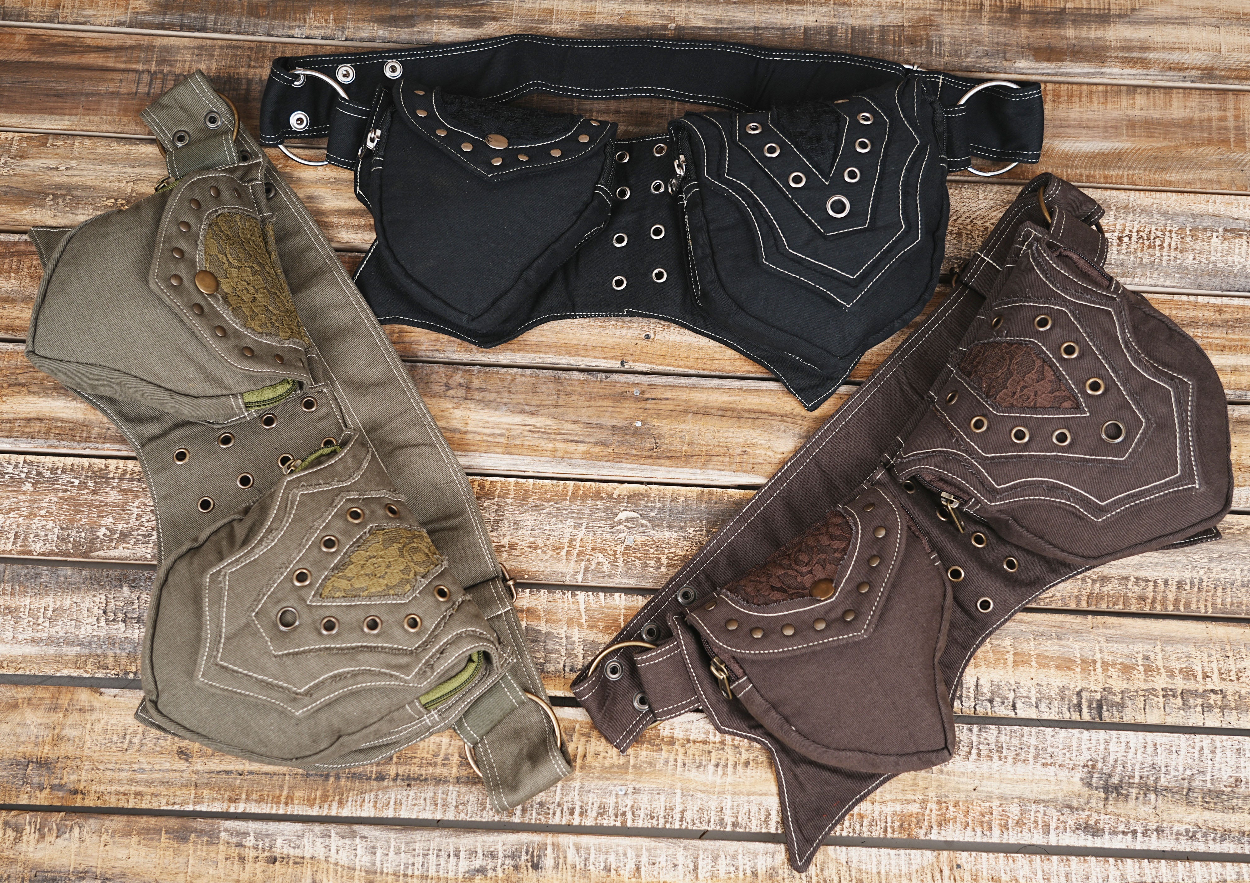 A durable and adjustable black cotton hip belt pouch for music festivals or outdoor wear.