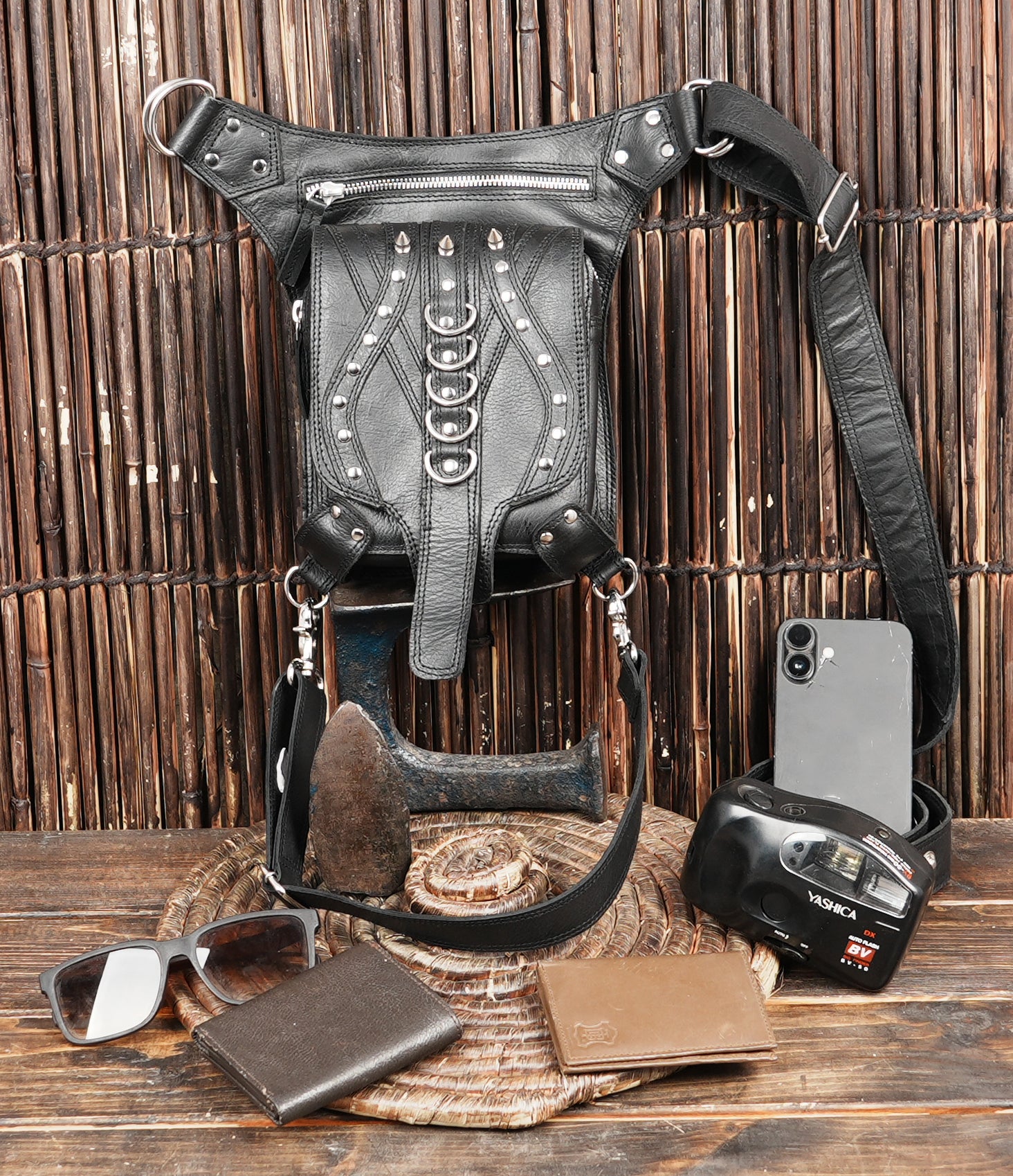 Black leather thigh belt accessory with rings and buckles