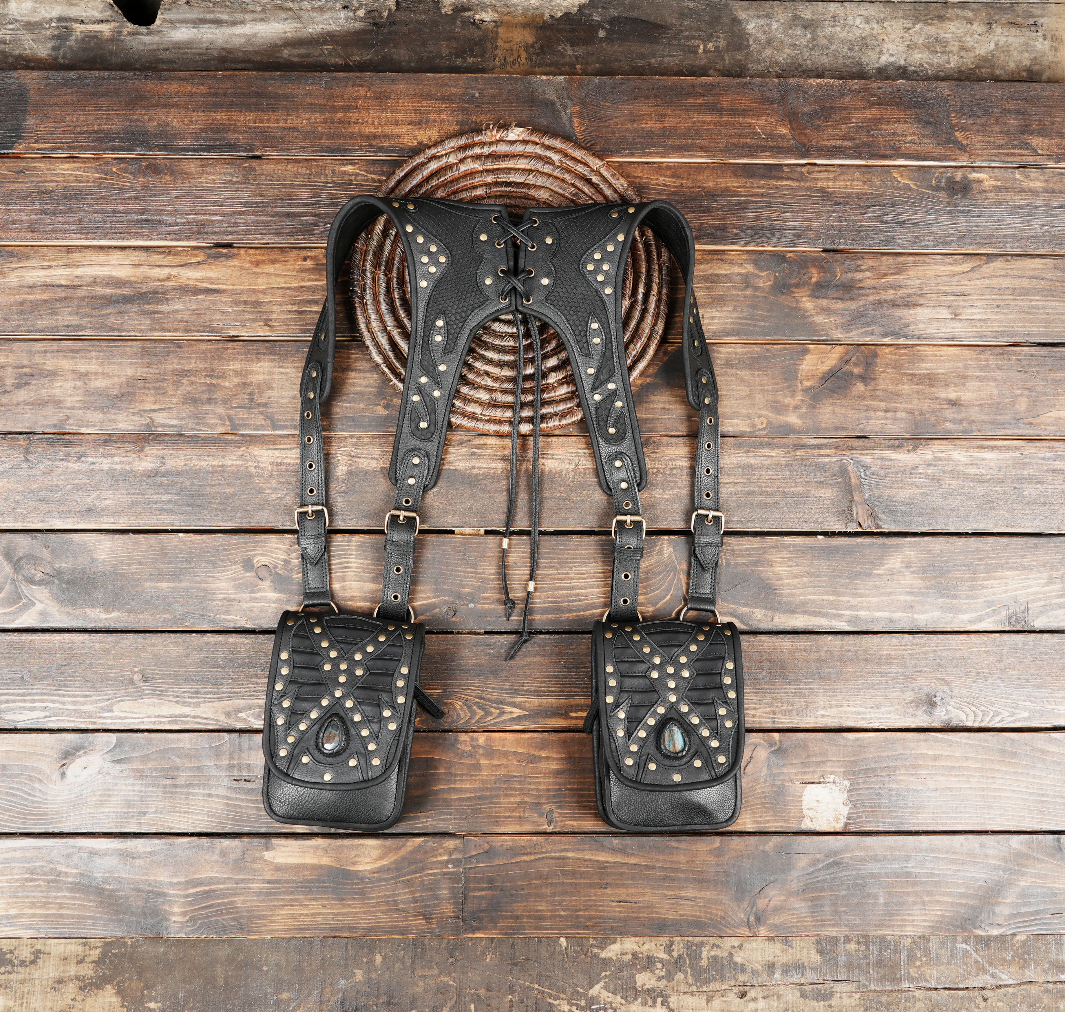 Handmade black leather harness bag with brass studs