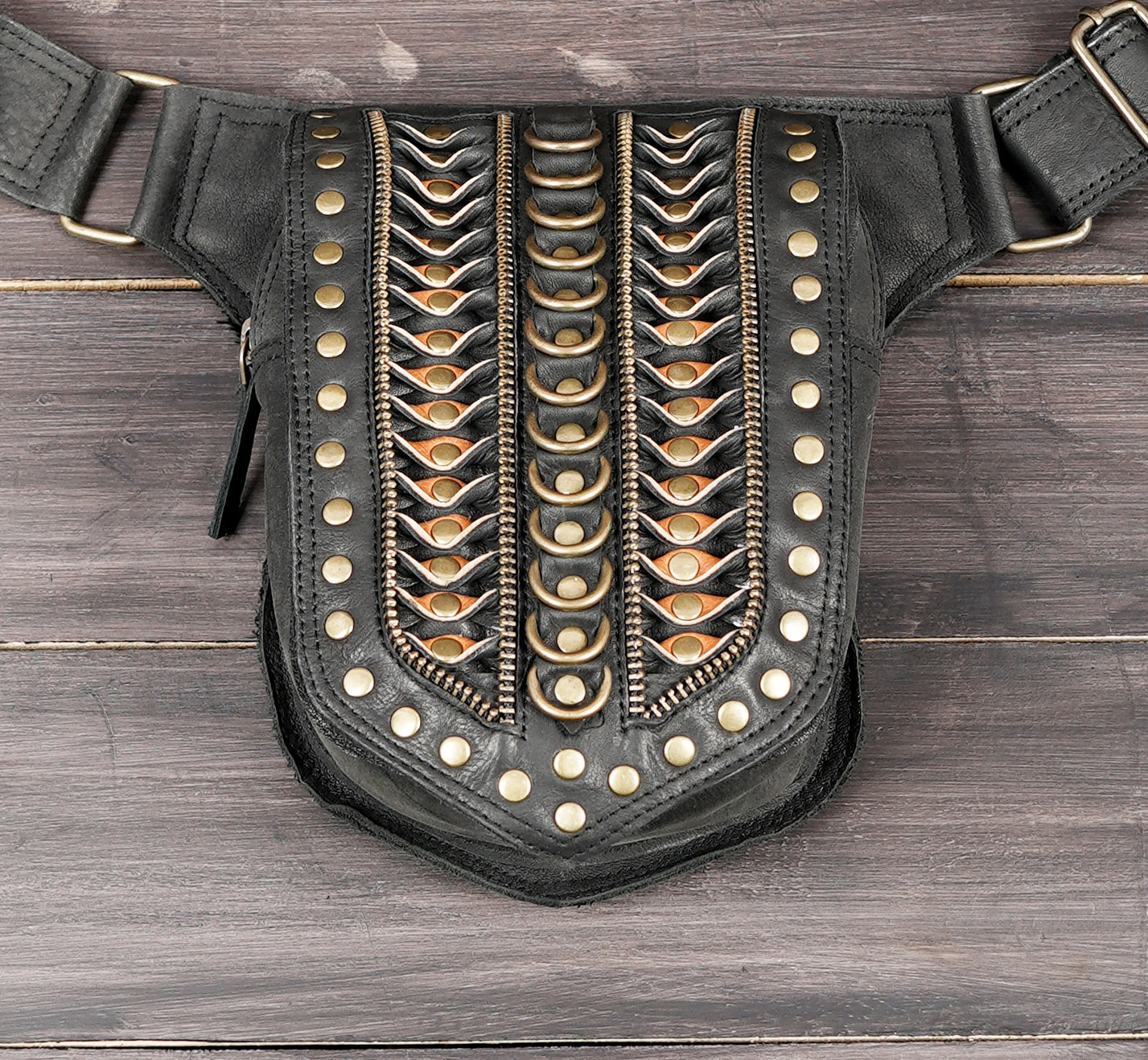 Brown and black leather utility waist belt.