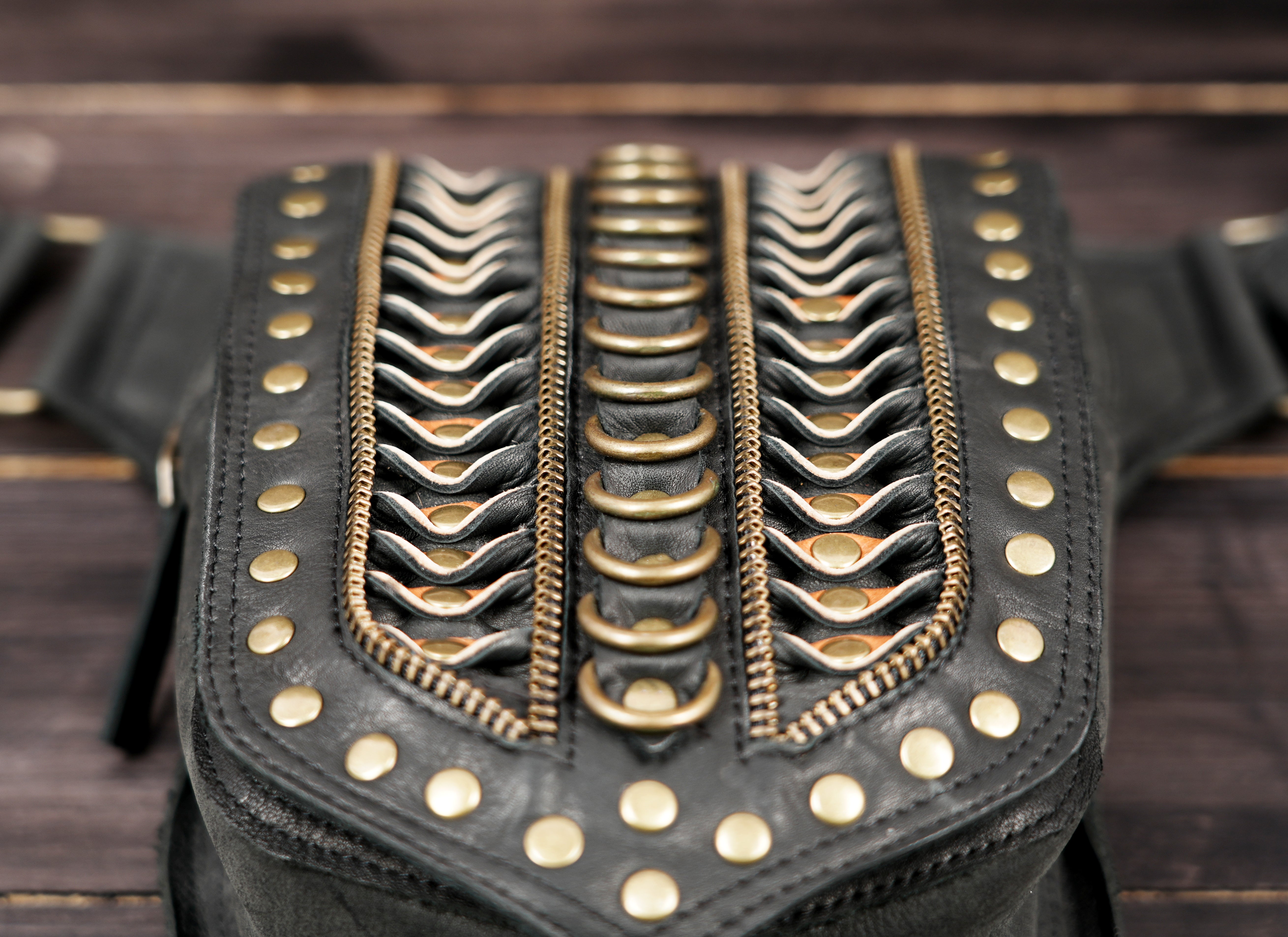 Genuine leather waist belt with brass rings.
