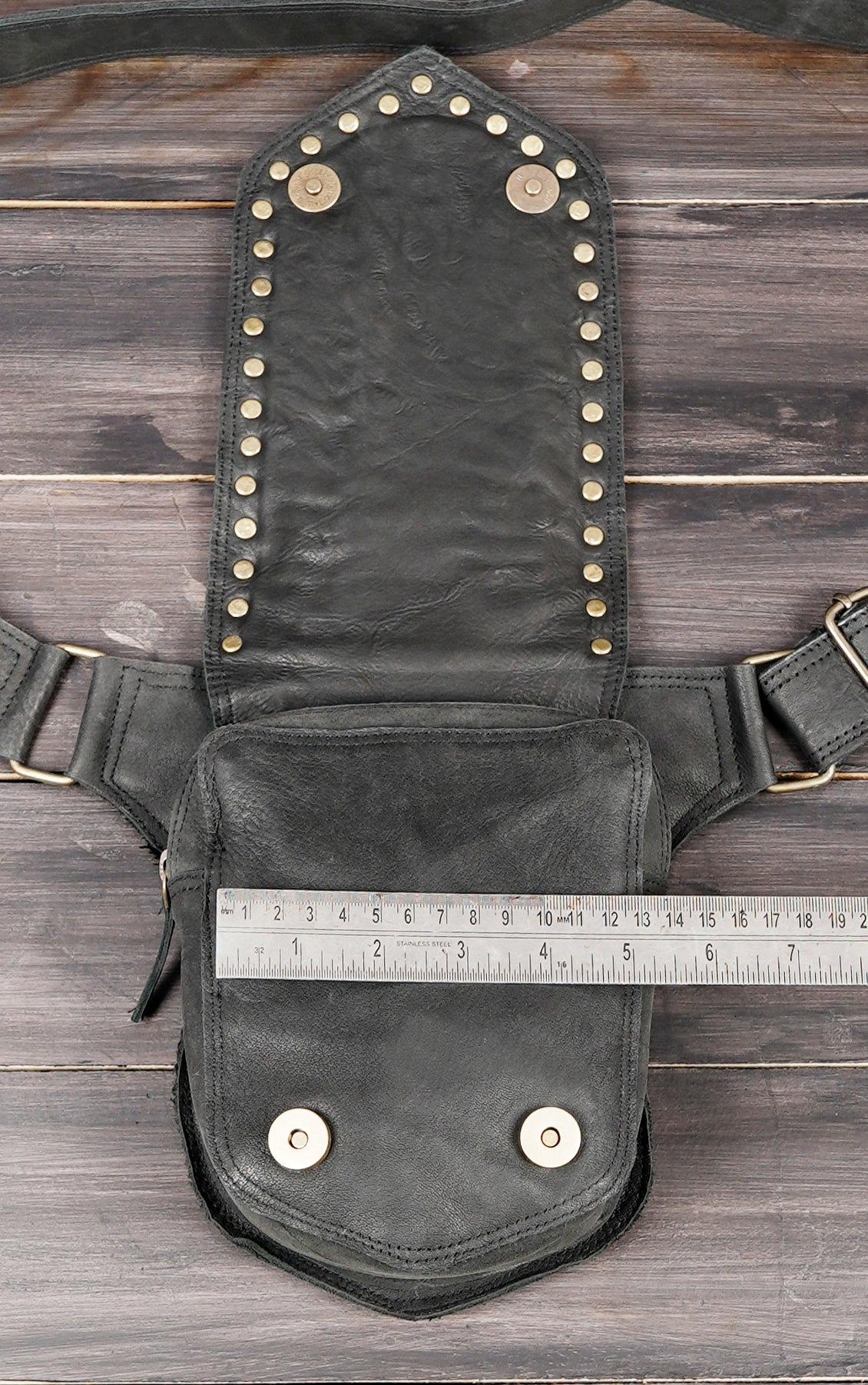 Leather utility belt with zipper pockets.