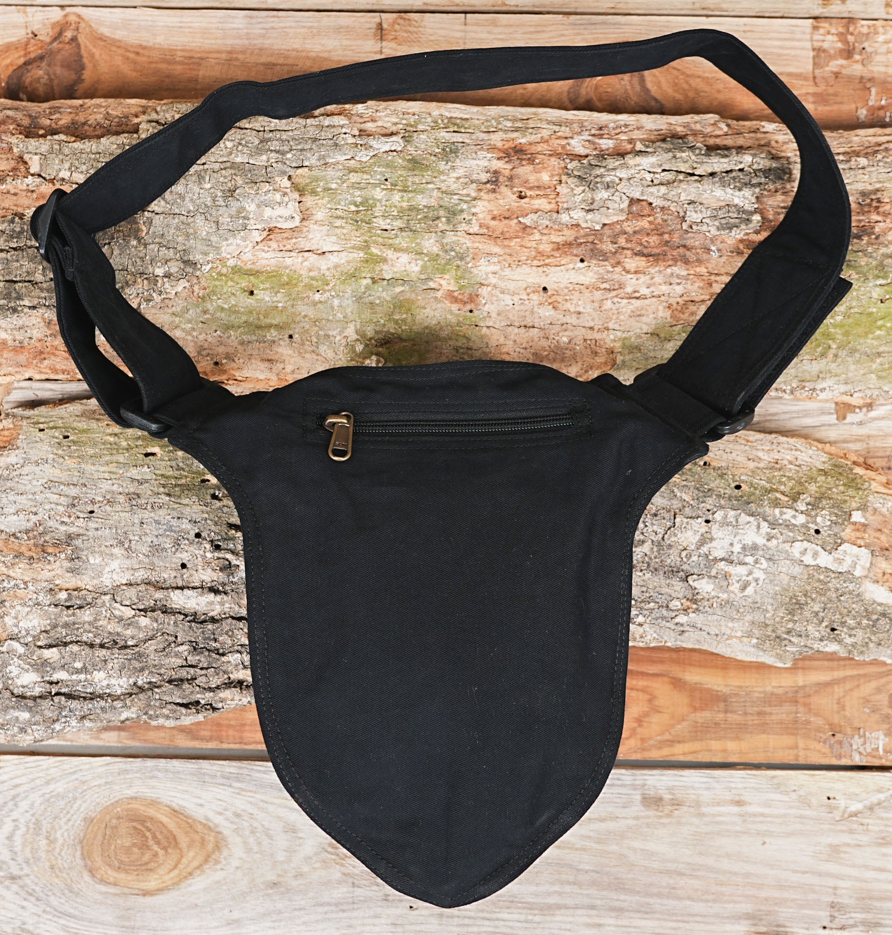 Black waist pouch designed for travel and everyday use