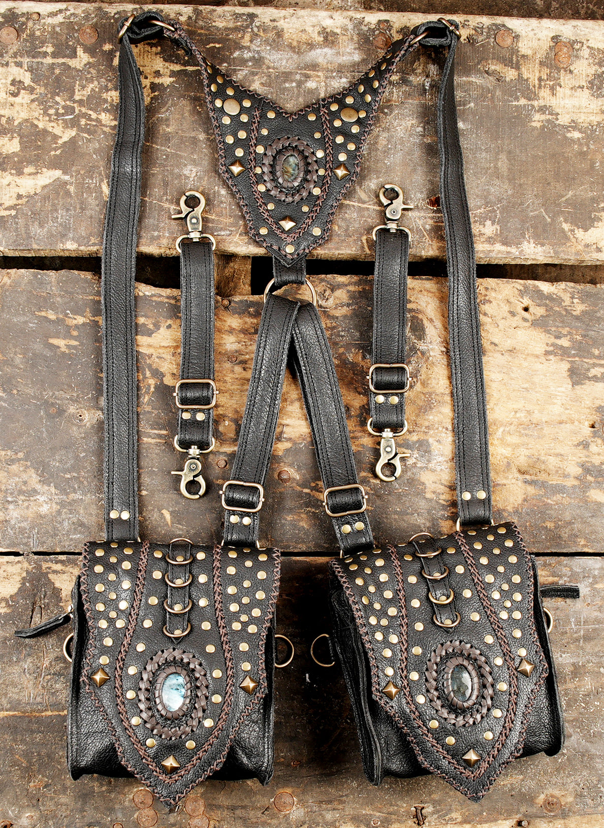 Handmade black leather holster harness with dual pouches and gemstone accents”