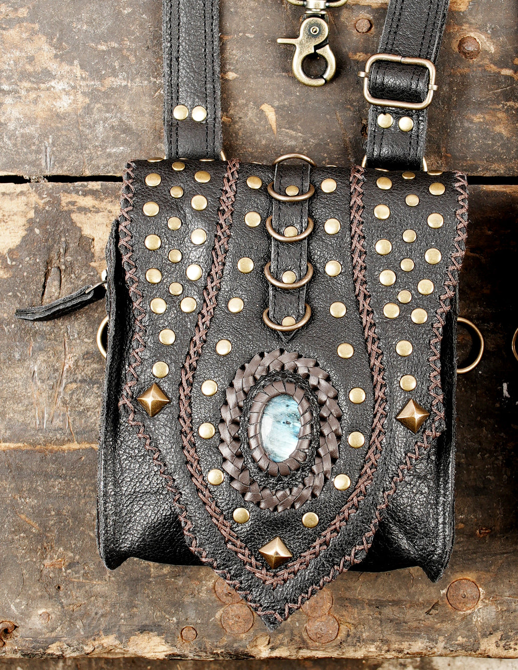 “Artisan black leather chest rig with two bags and adjustable straps”