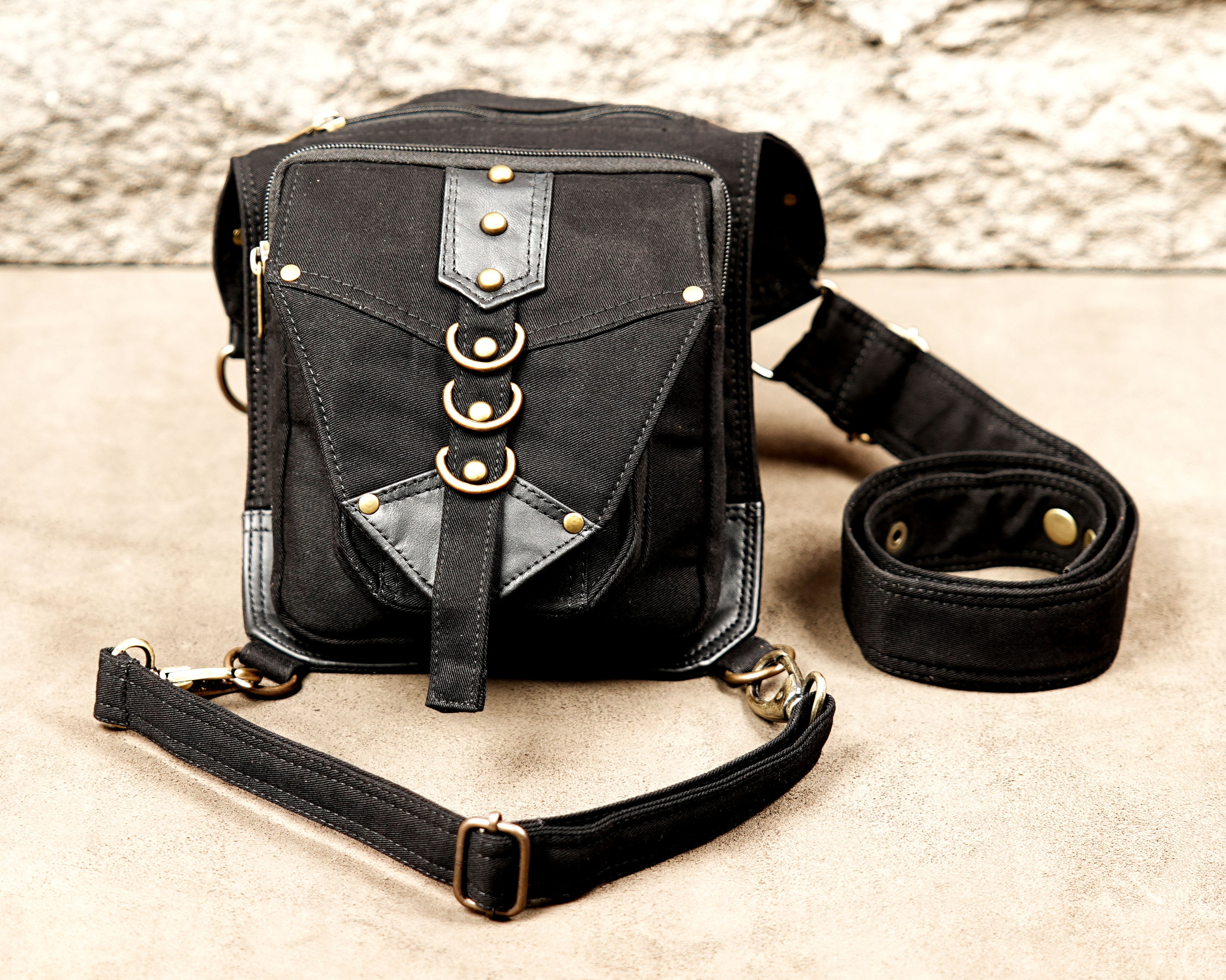 Biker style cotton thigh bag with swivel snap hooks and zippered compartments.