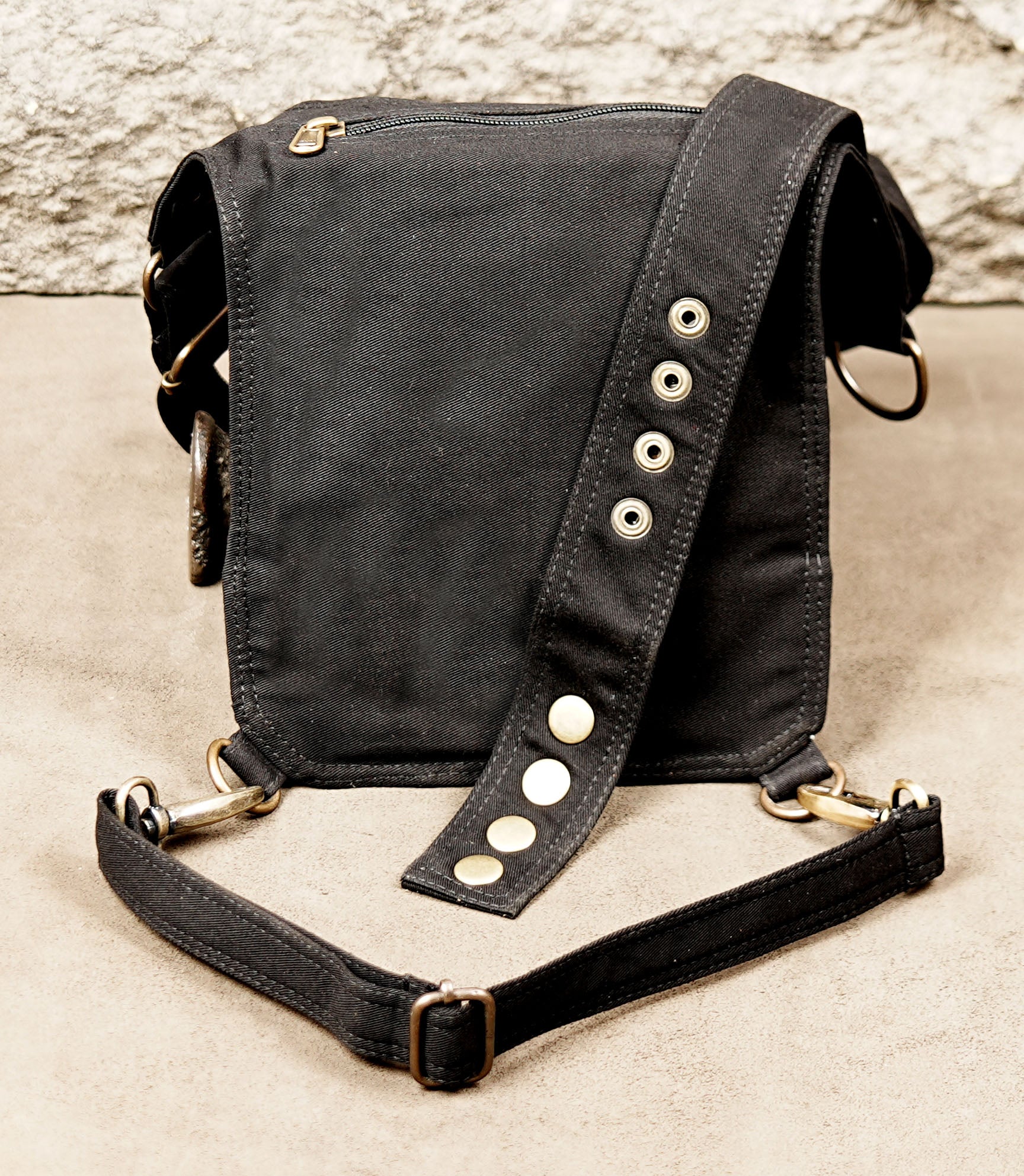 Hands-free festival utility hip pouch with adjustable waist and leg strap buckles.