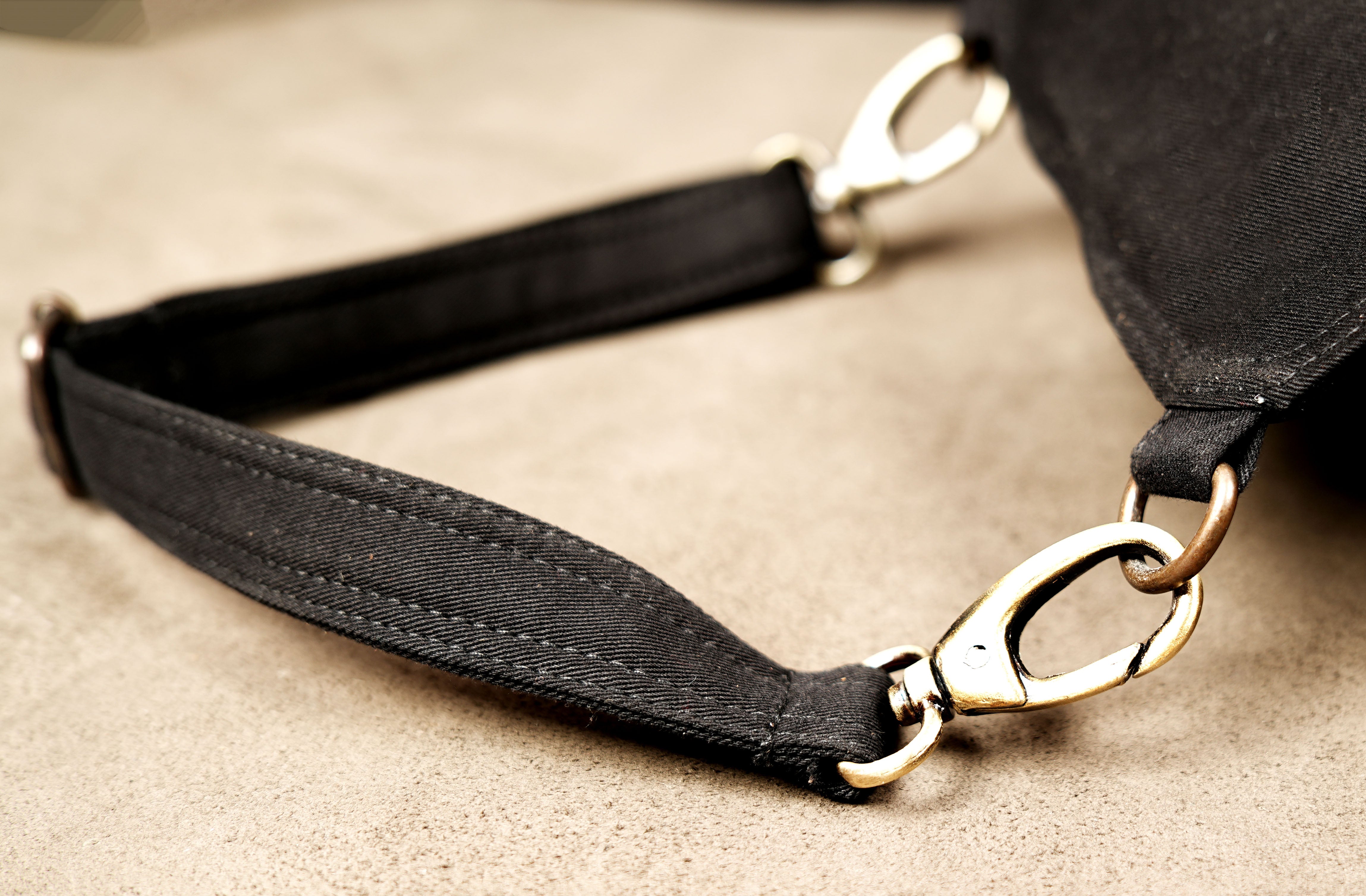 Tribal style canvas side thigh pack with front flap pocket and brass ring trims.