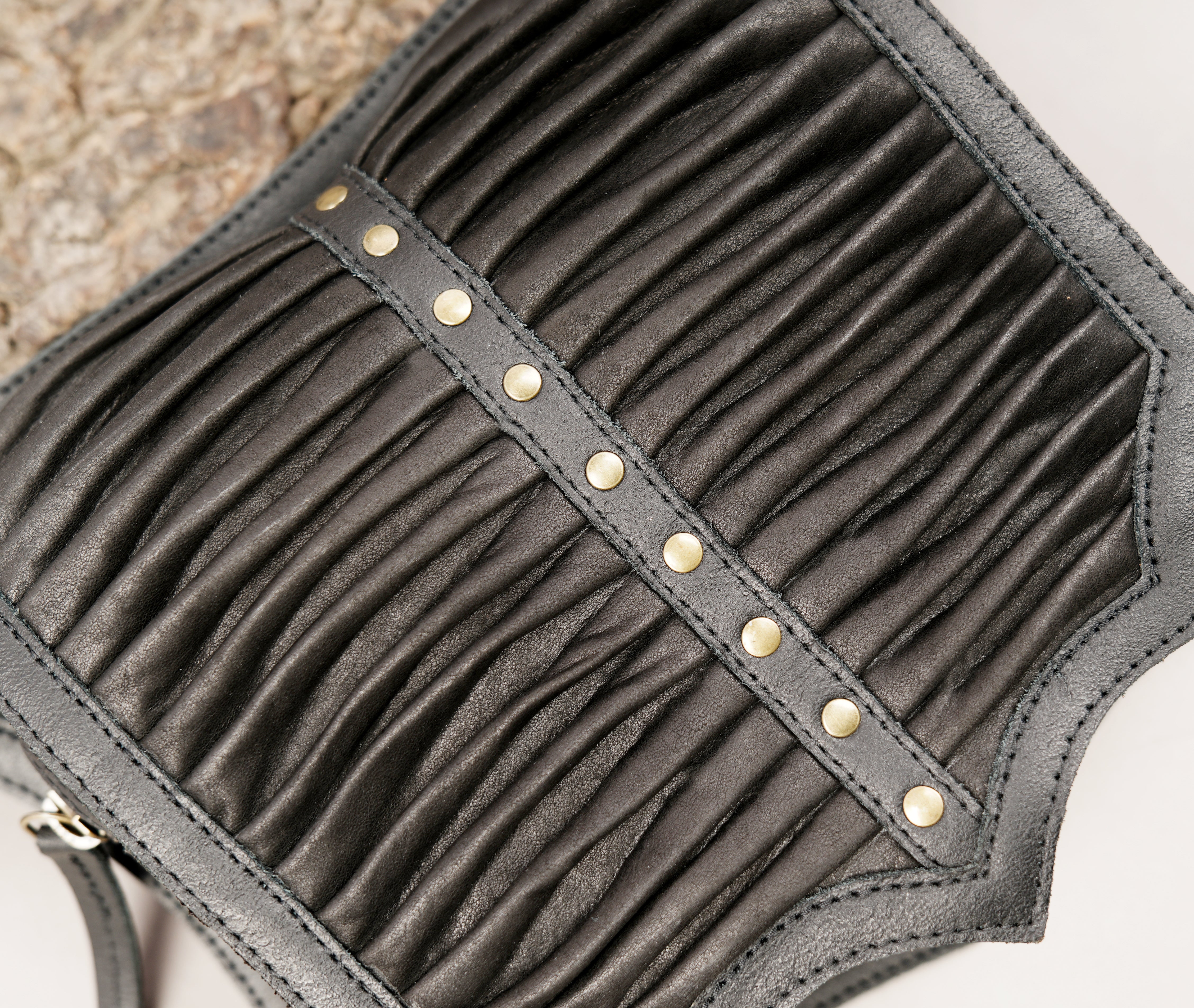 Handcrafted leather hip belt with structured pleated design