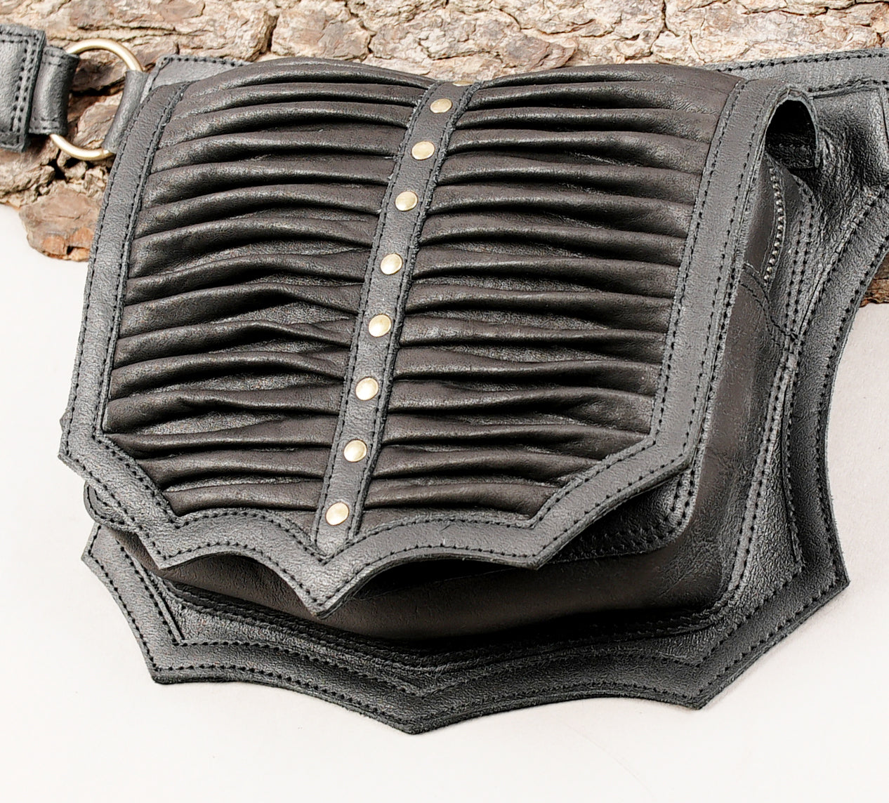 Minimal black leather waist belt with pleated panel detail