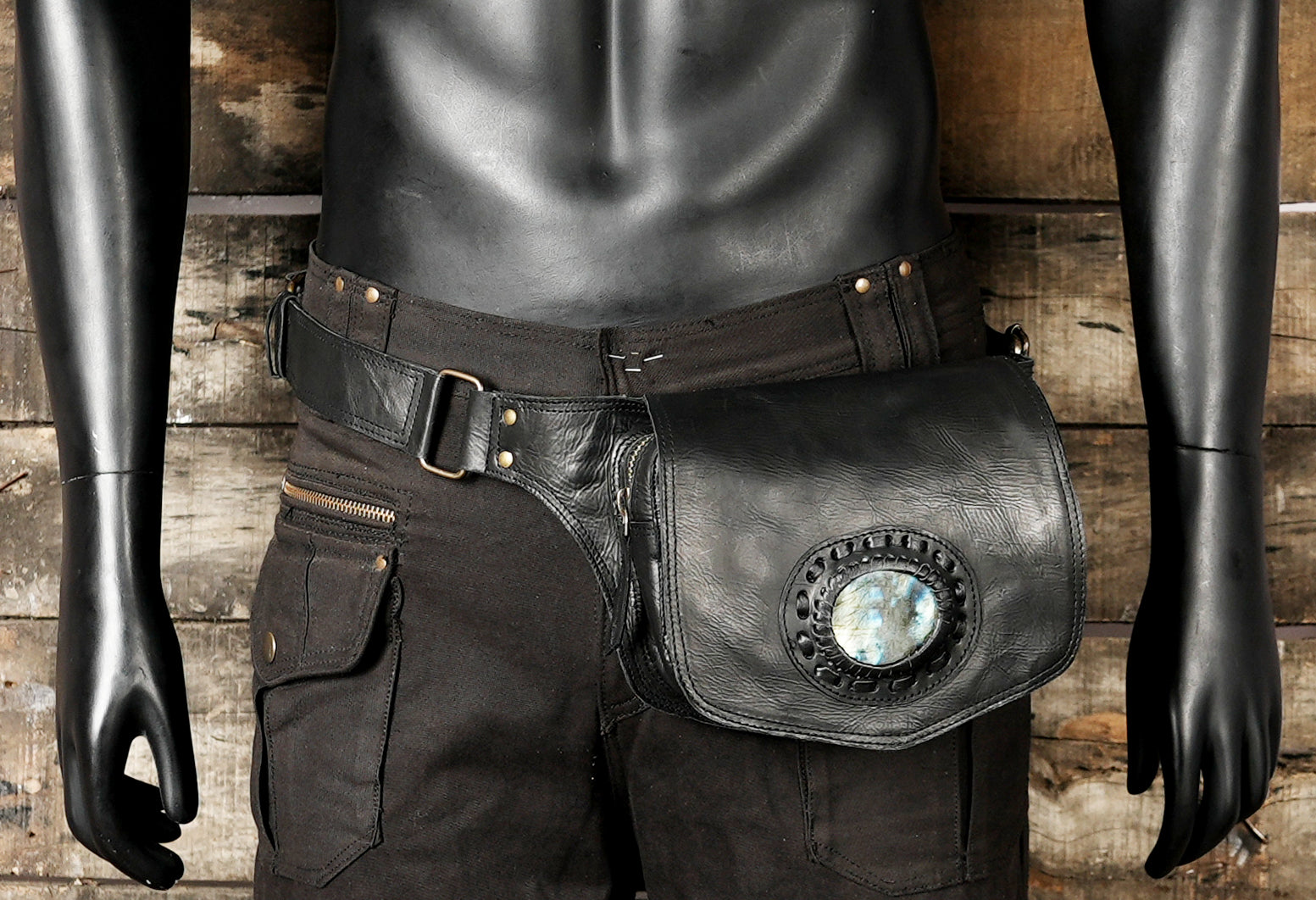 Leather travel waist pouch with decorative stone on front flap