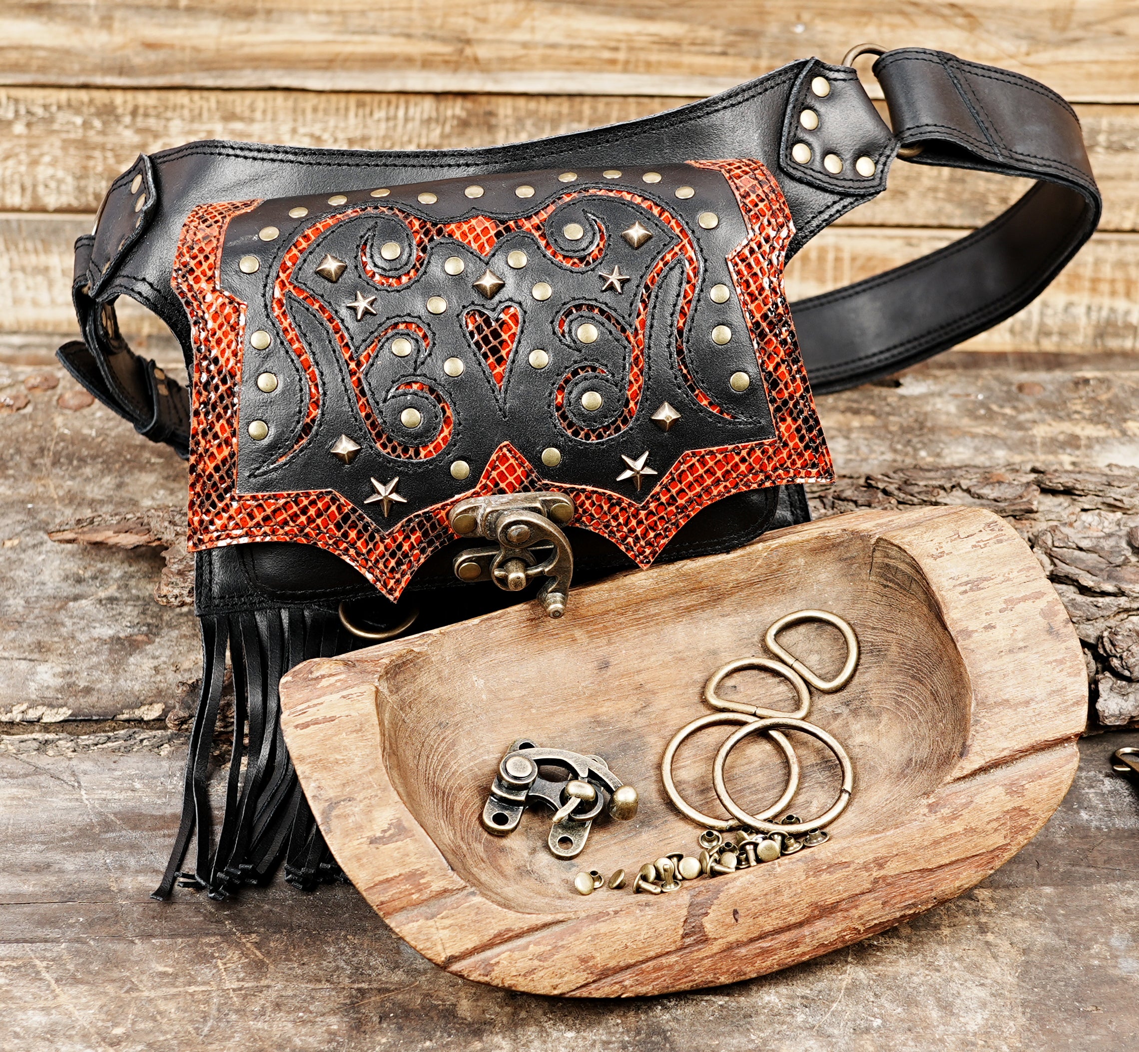 Festival ready leather waist belt with ornate design and long black fringe