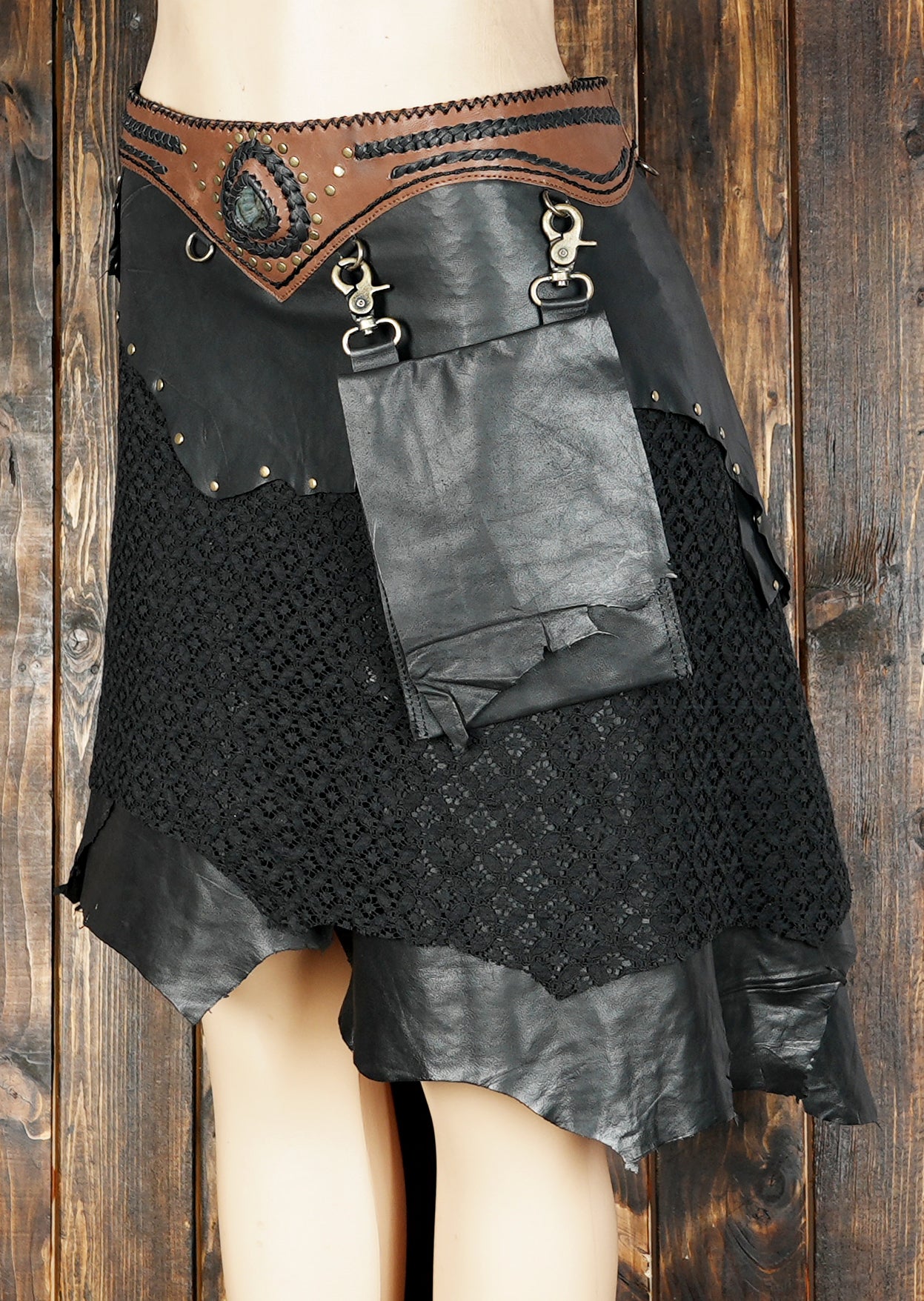 Handmade black leather western skirt with lace details, decorative studs, and rustic waistband
