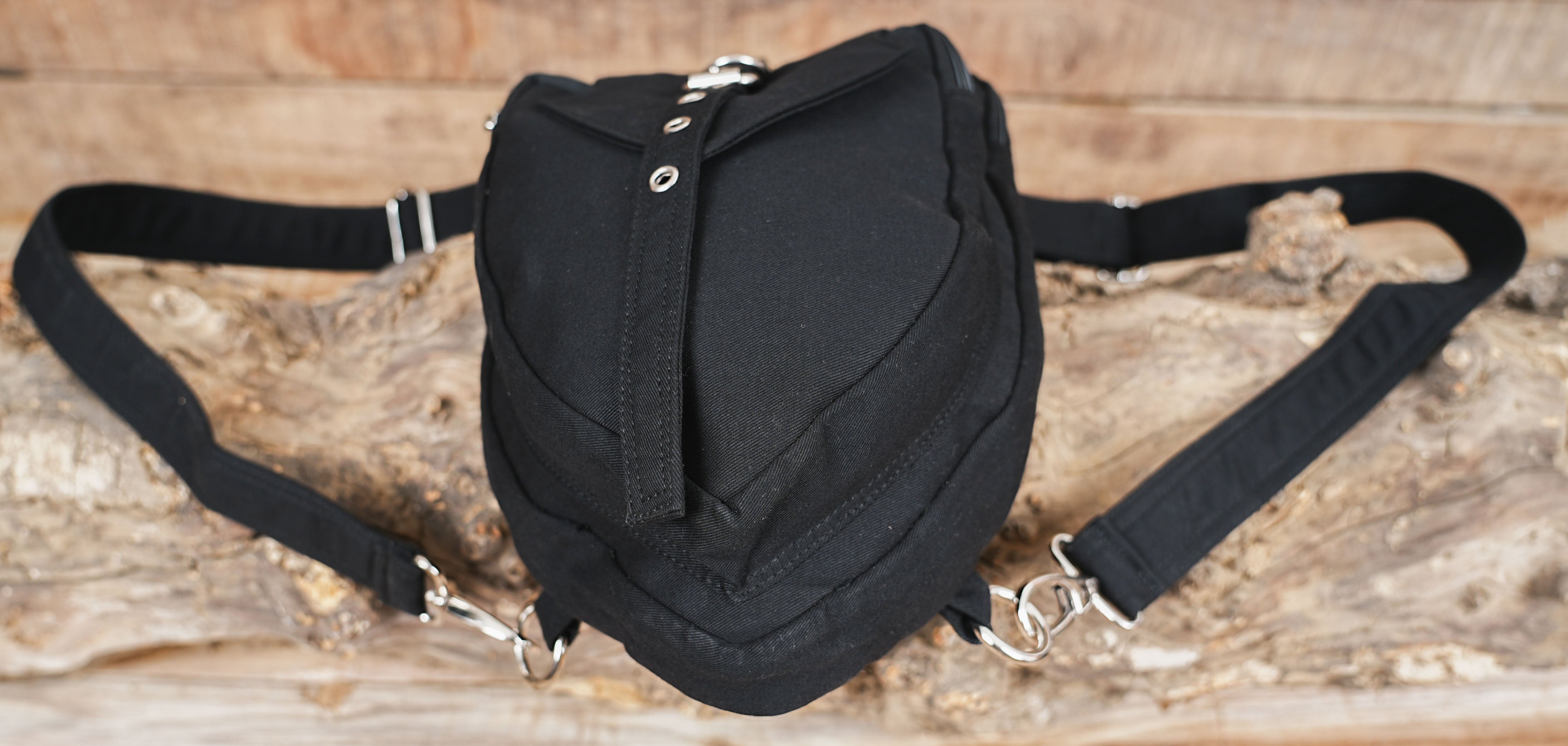 Versatile canvas shoulder holster and waist pack equipped with secure compartments