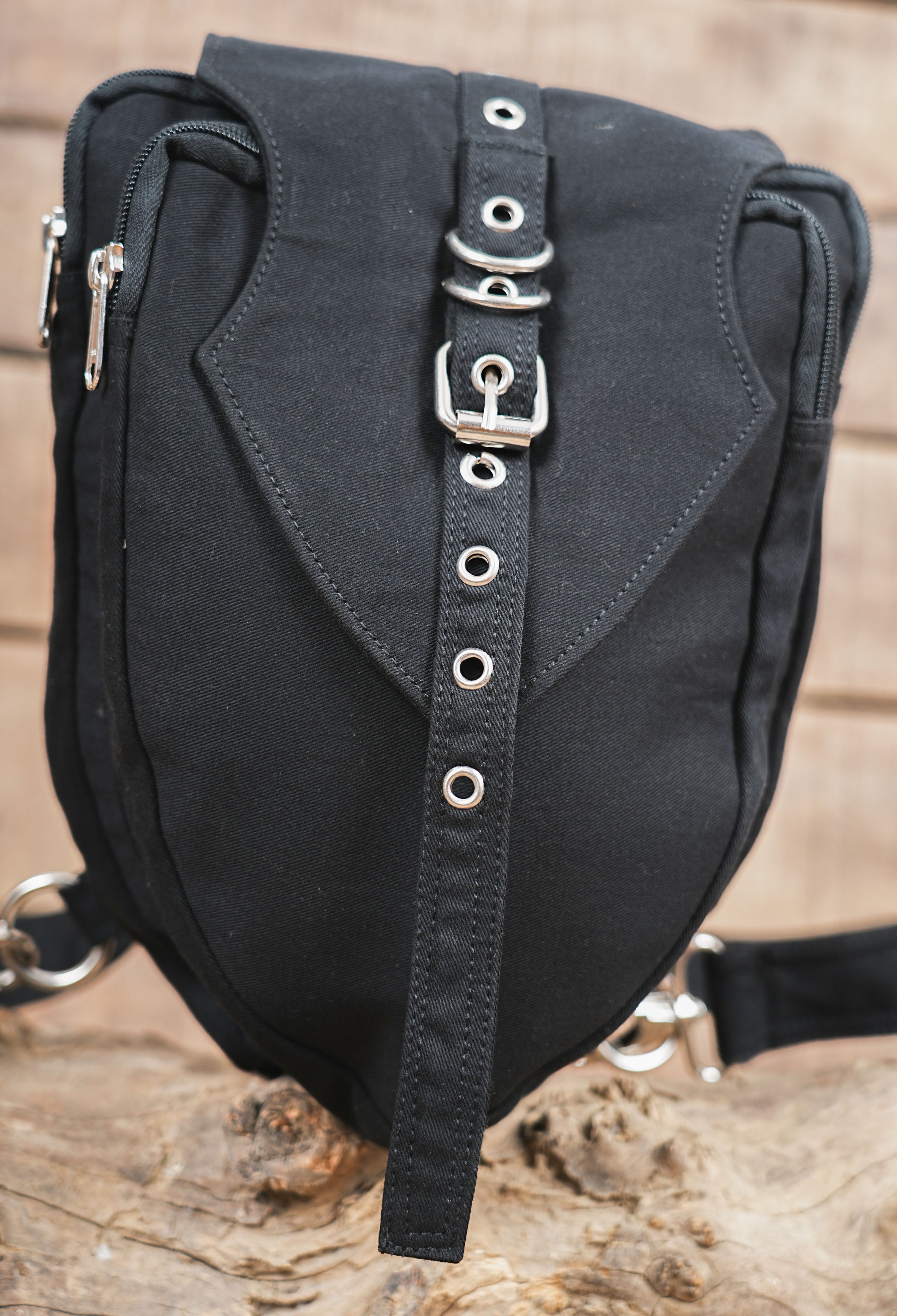 Versatile multi-way shoulder pack with a distinctive front buckle accent