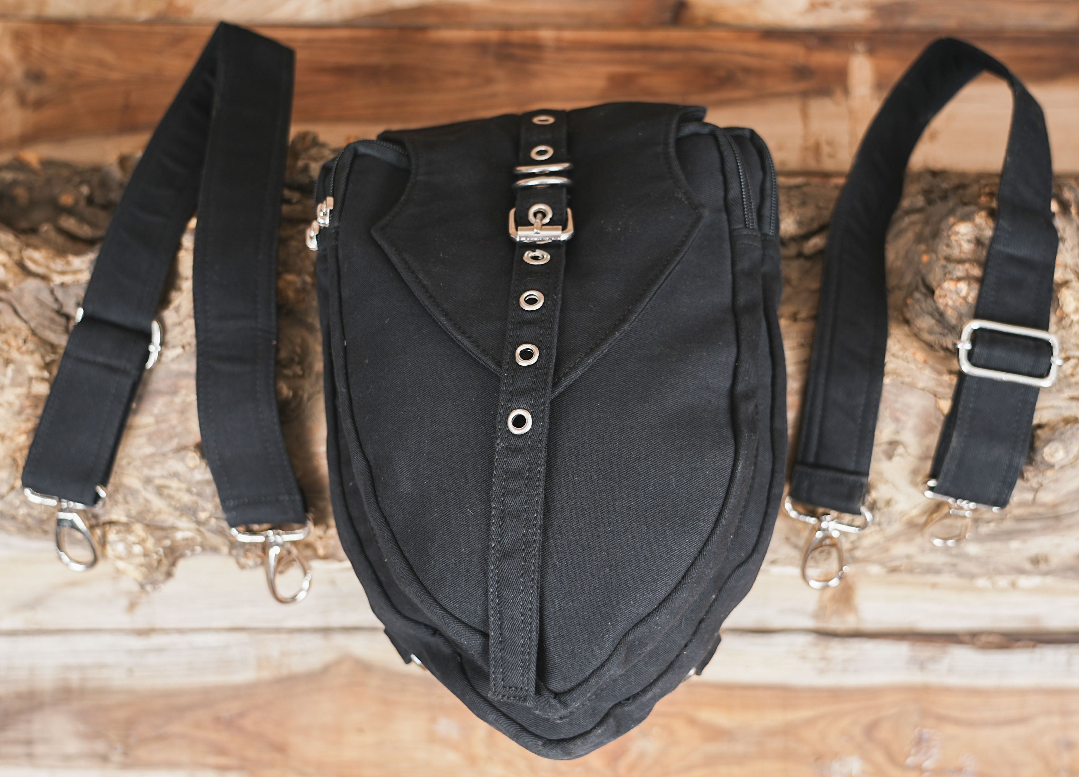 Unisex canvas shoulder belt bag featuring adjustable body straps and a secure front pouch