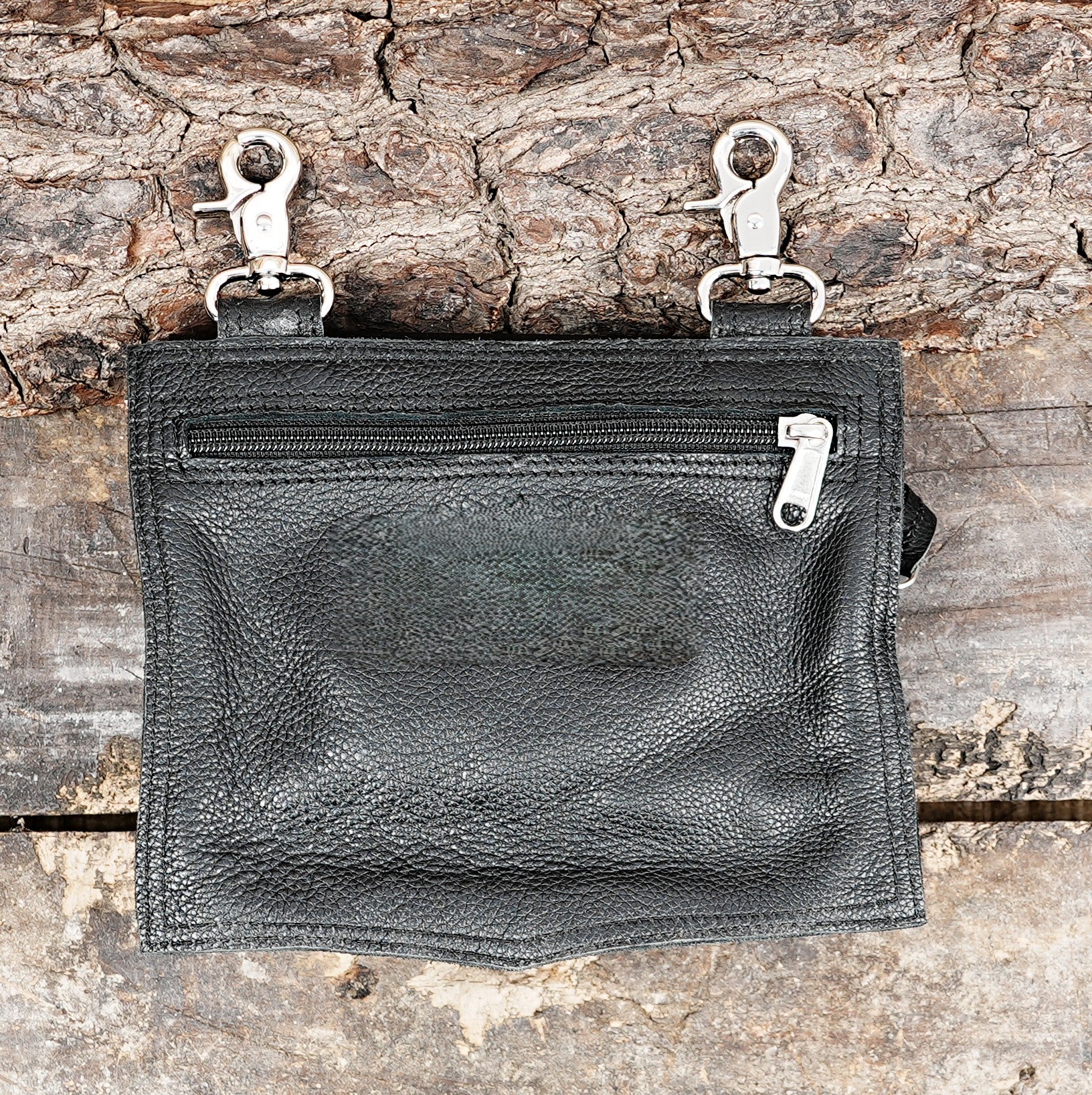 Leather belt pouch with secure buckle fastening