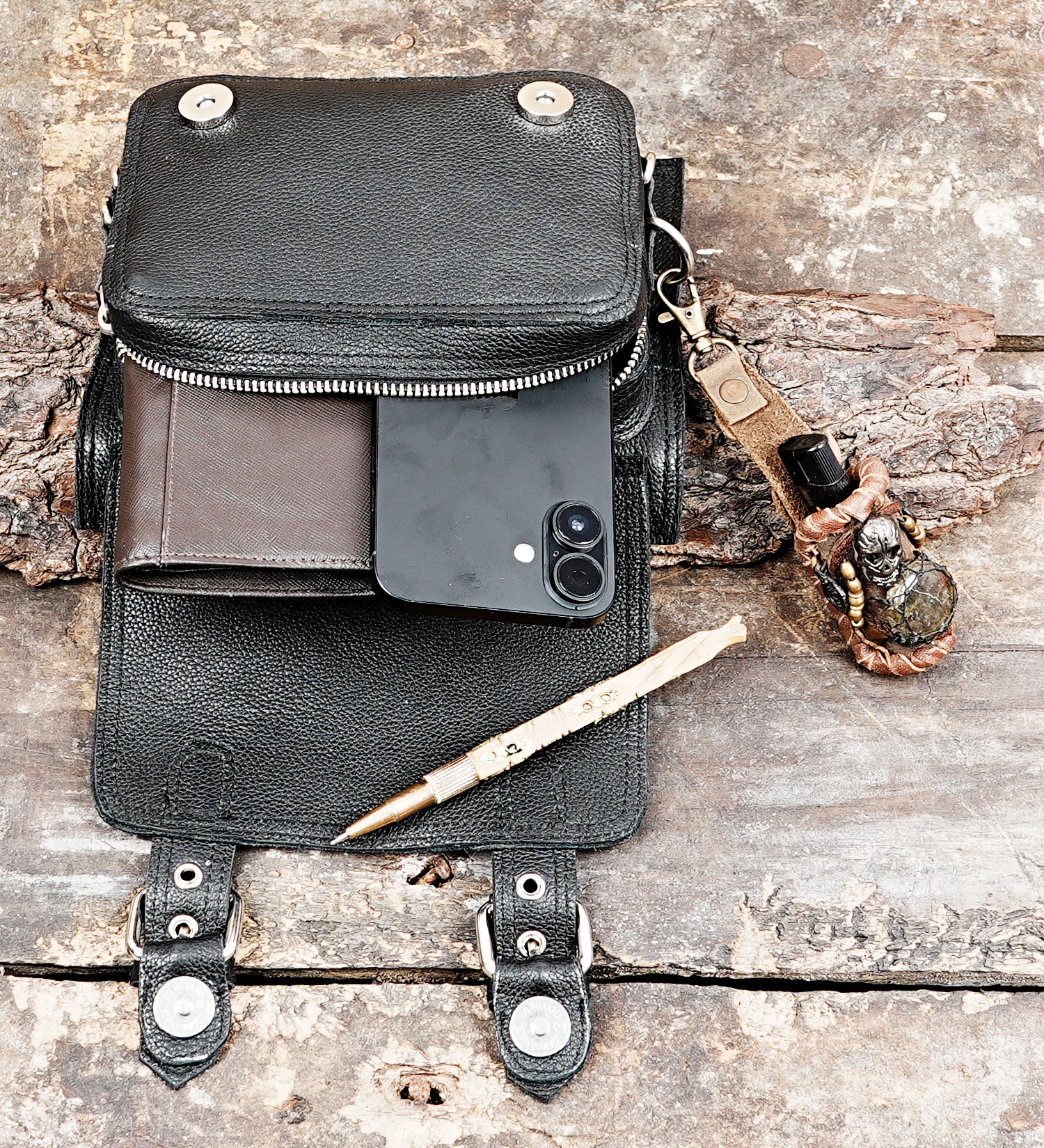 Leather utility pouch with strong buckle straps