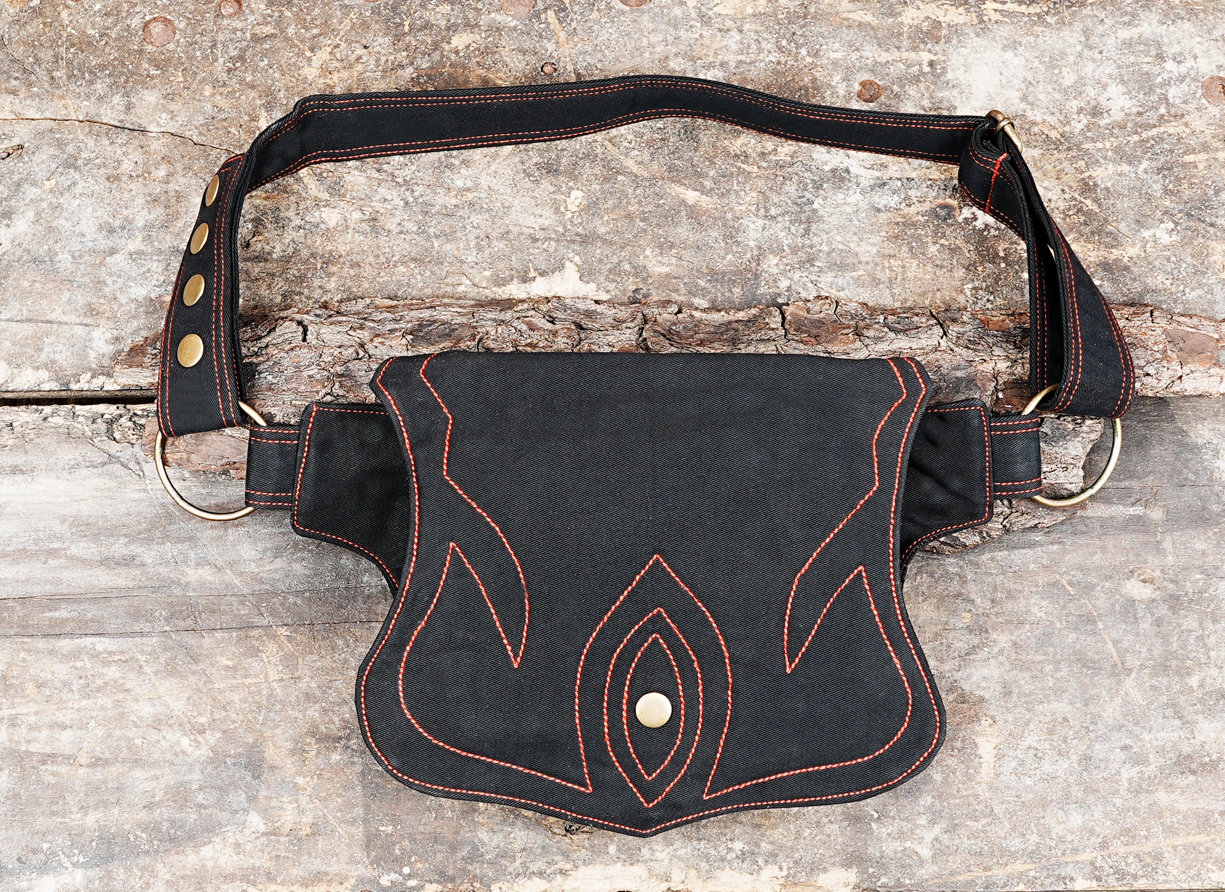 Black canvas fanny pack with orange flame stitching and brass snap closure