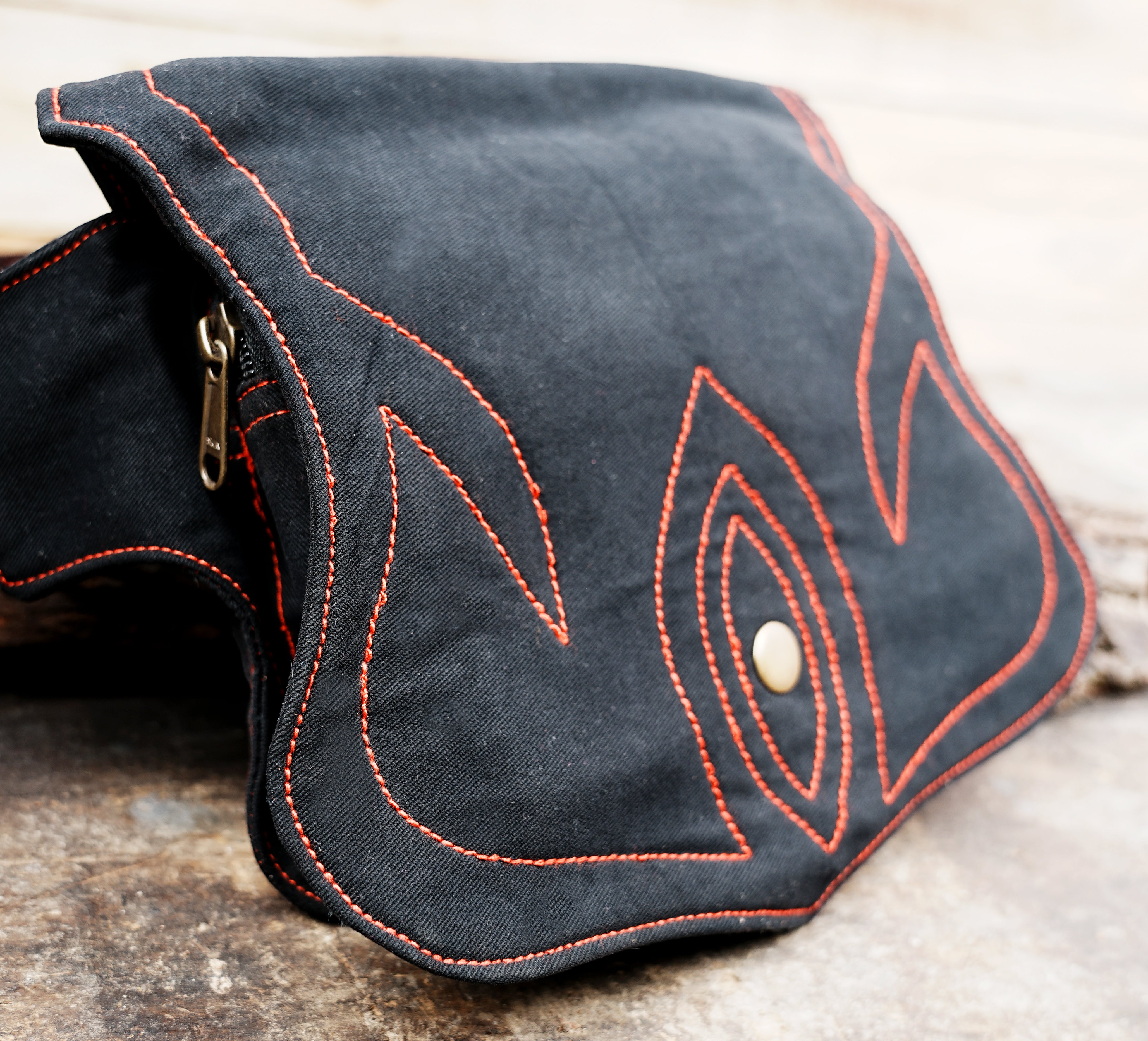 Handmade black bum bag with red stitch detail, ideal for hiking and daily use