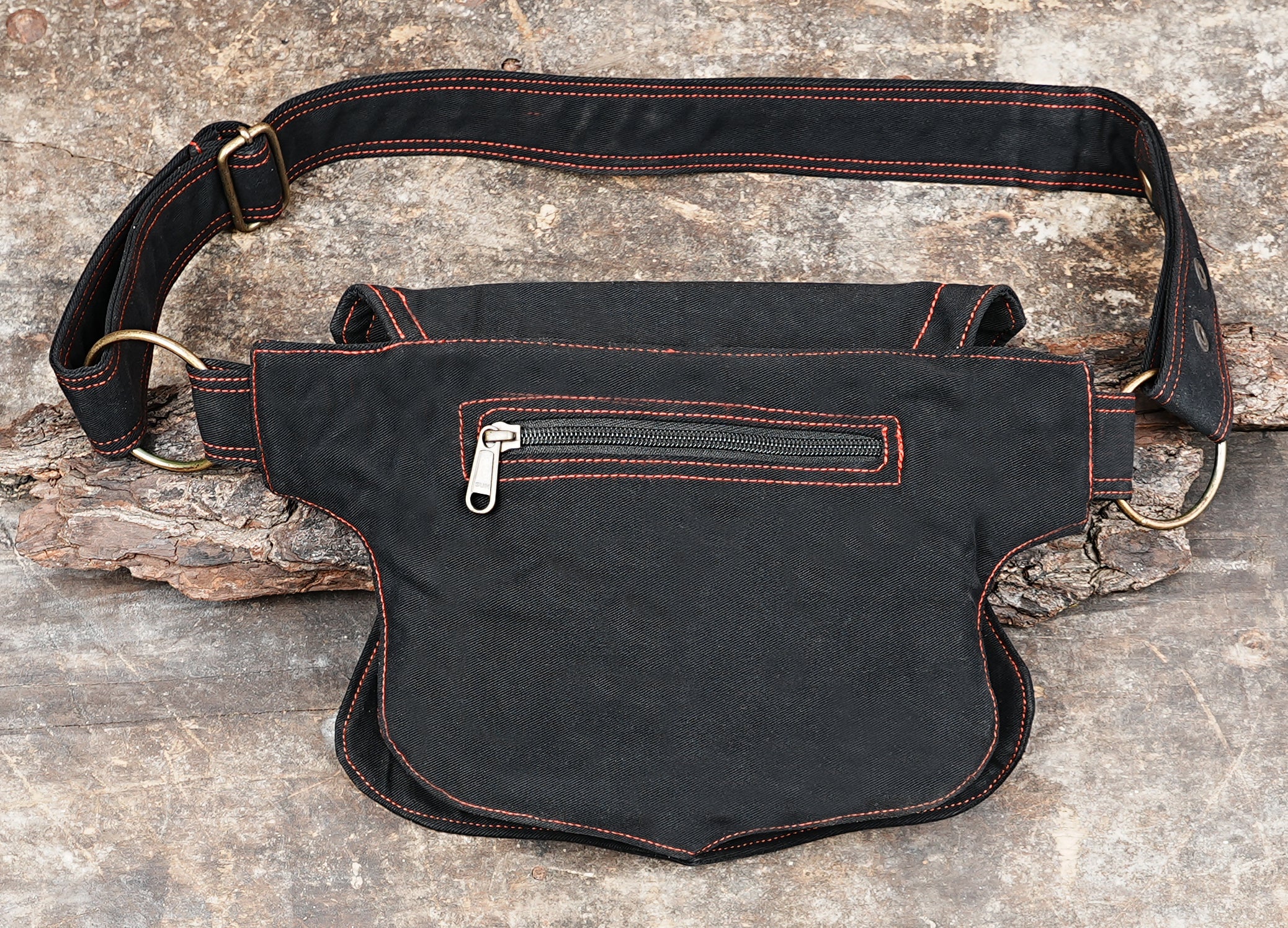 Black canvas hip bag with red flame stitch detail, festival ready accessory