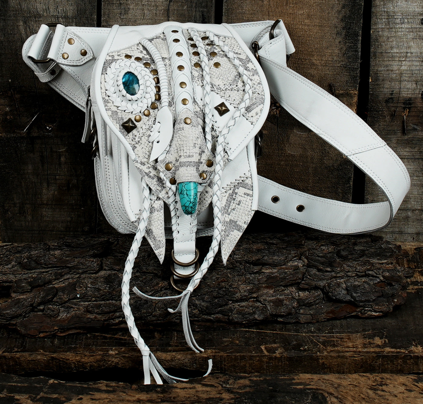 Boho-inspired black leather waist pouch for festivals and travel