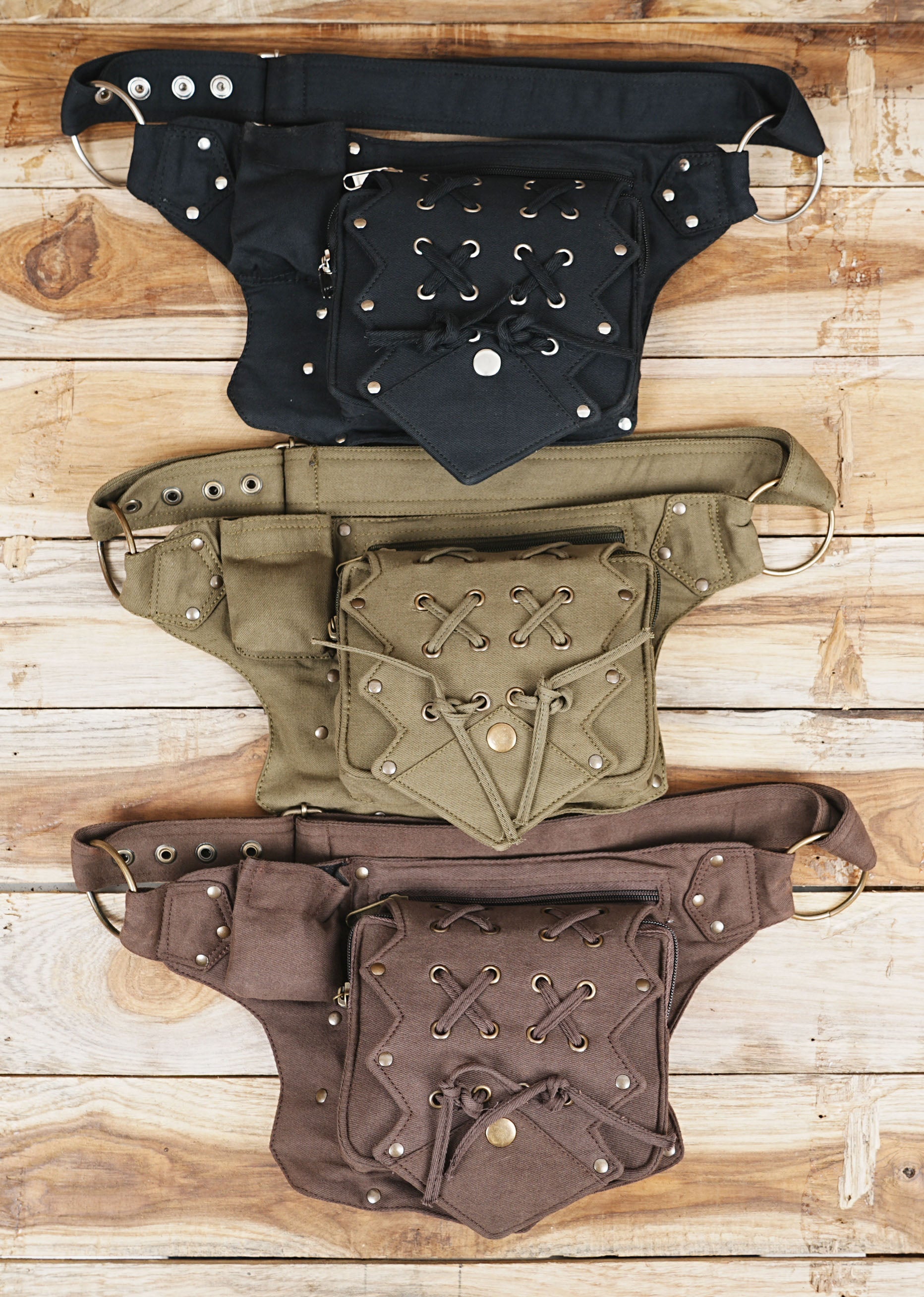 Premium black canvas utility fanny pack, practical and stylish, on concrete surface.