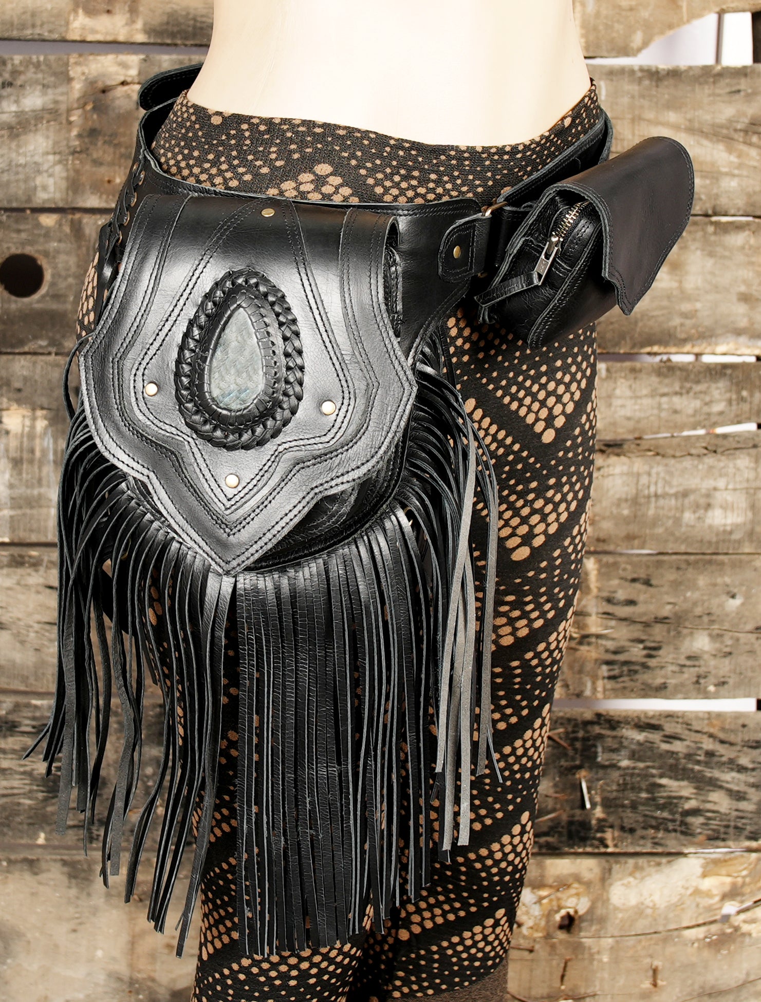 Hand-stitched leather thigh holster with bohemian look