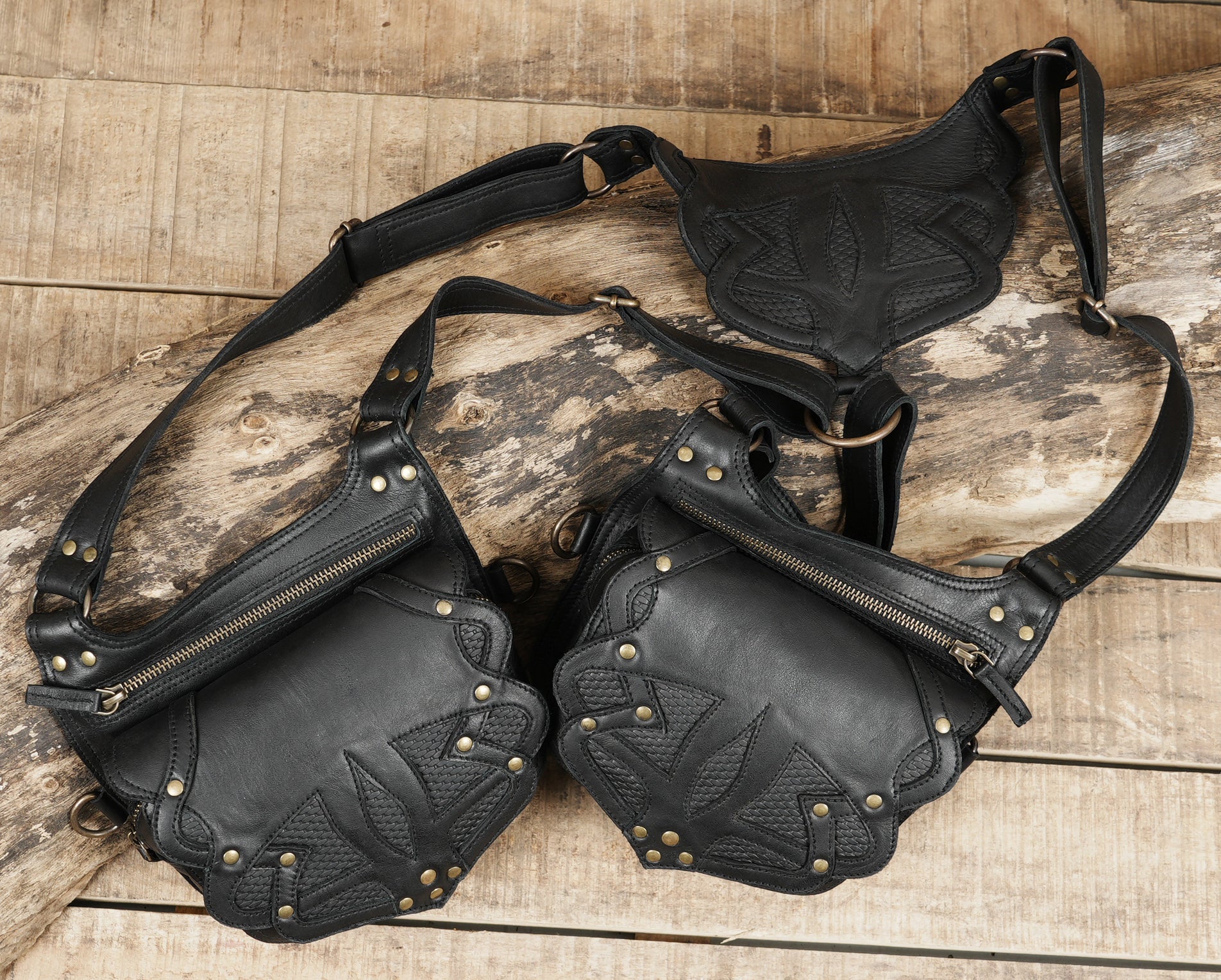 Leather chest holster with embossed tribal detailing and metal buckles