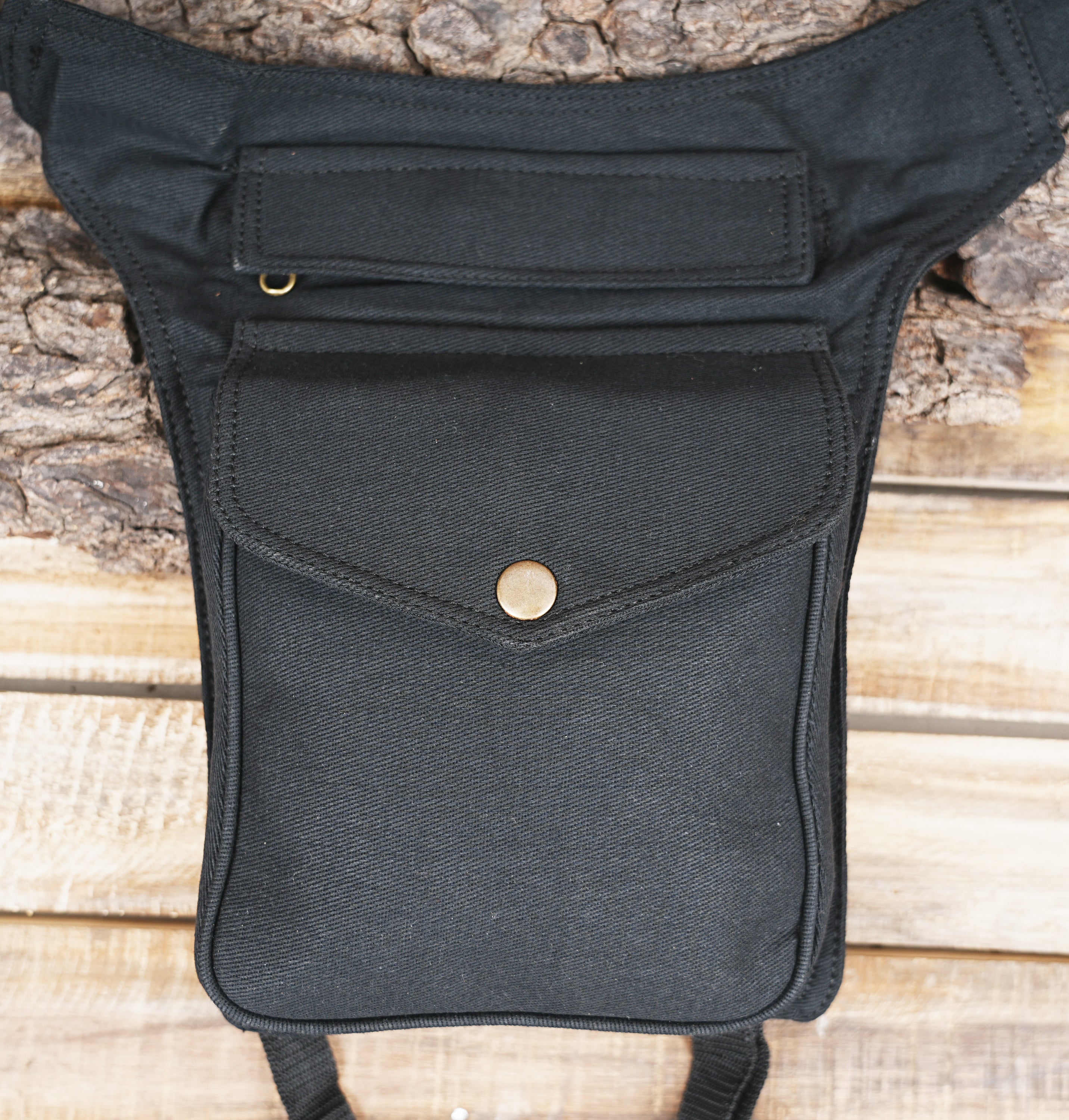 Tactical waist bag with snap button pocket and buckle closure