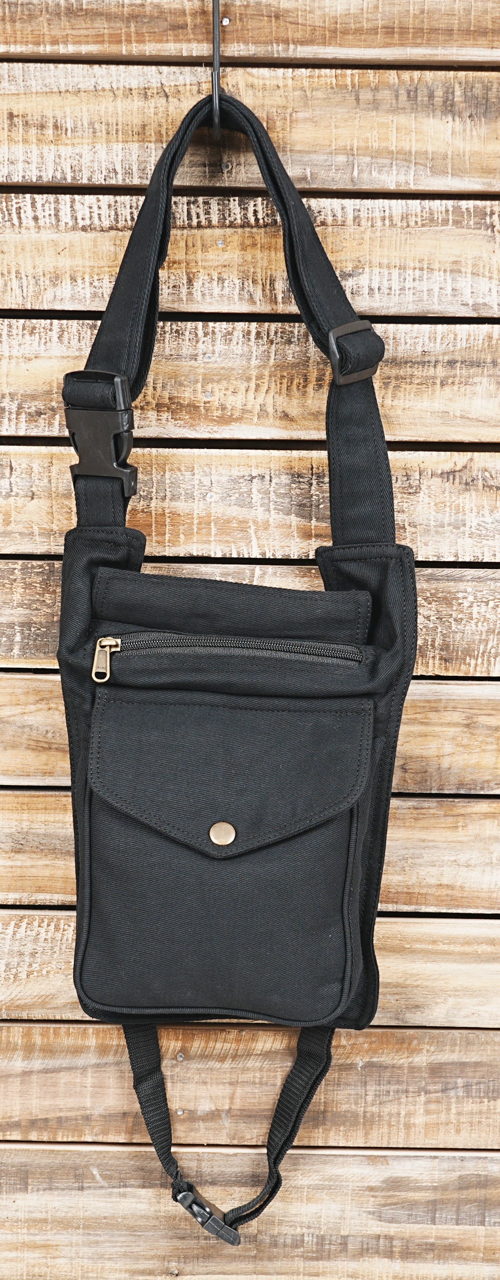 Women's black hip bag with thigh strap attachment