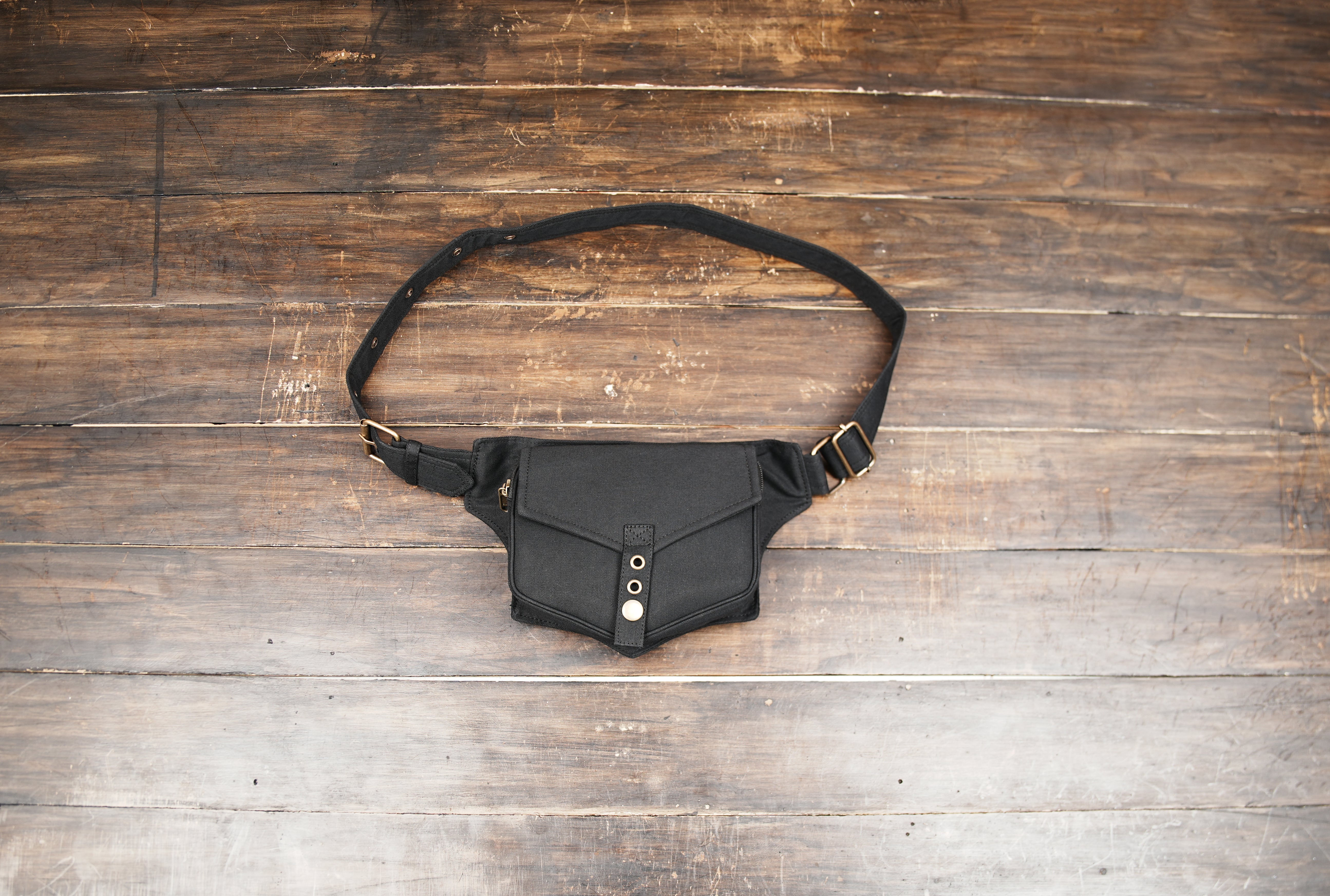 Black cotton waist belt bag with adjustable strap and secure flap pocket