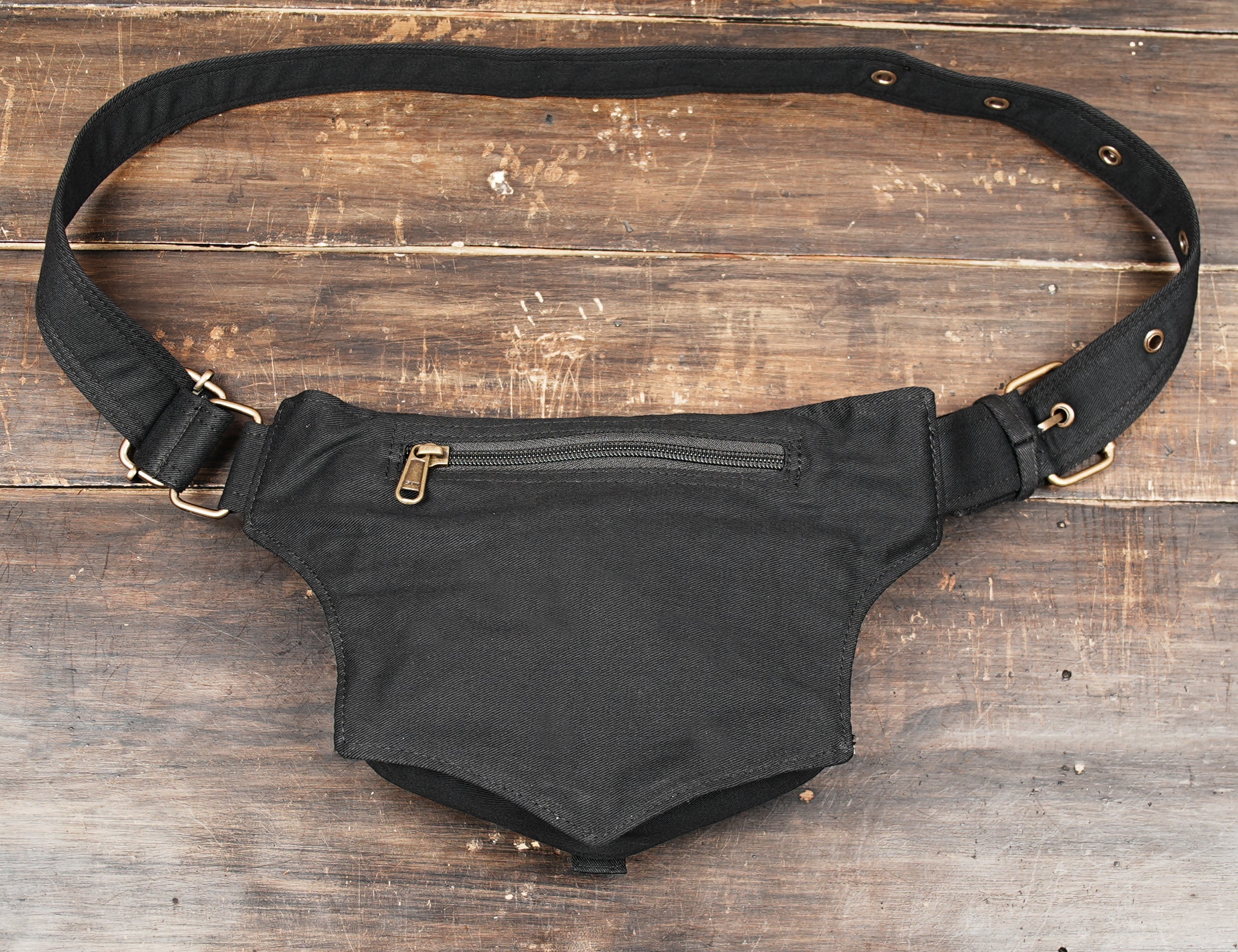 Black cotton fanny pack with zipper compartment and flap pocket