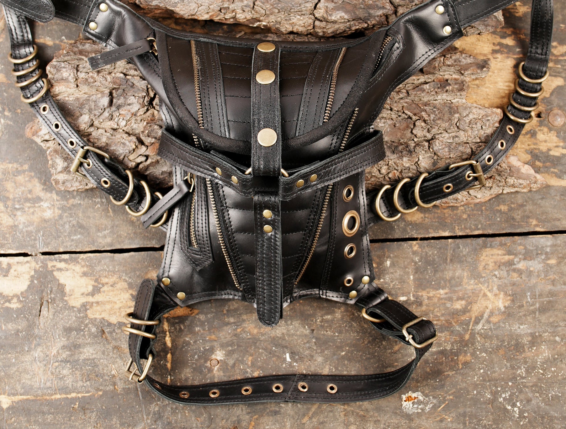 Leather waist thigh harness with metal rings and rivets