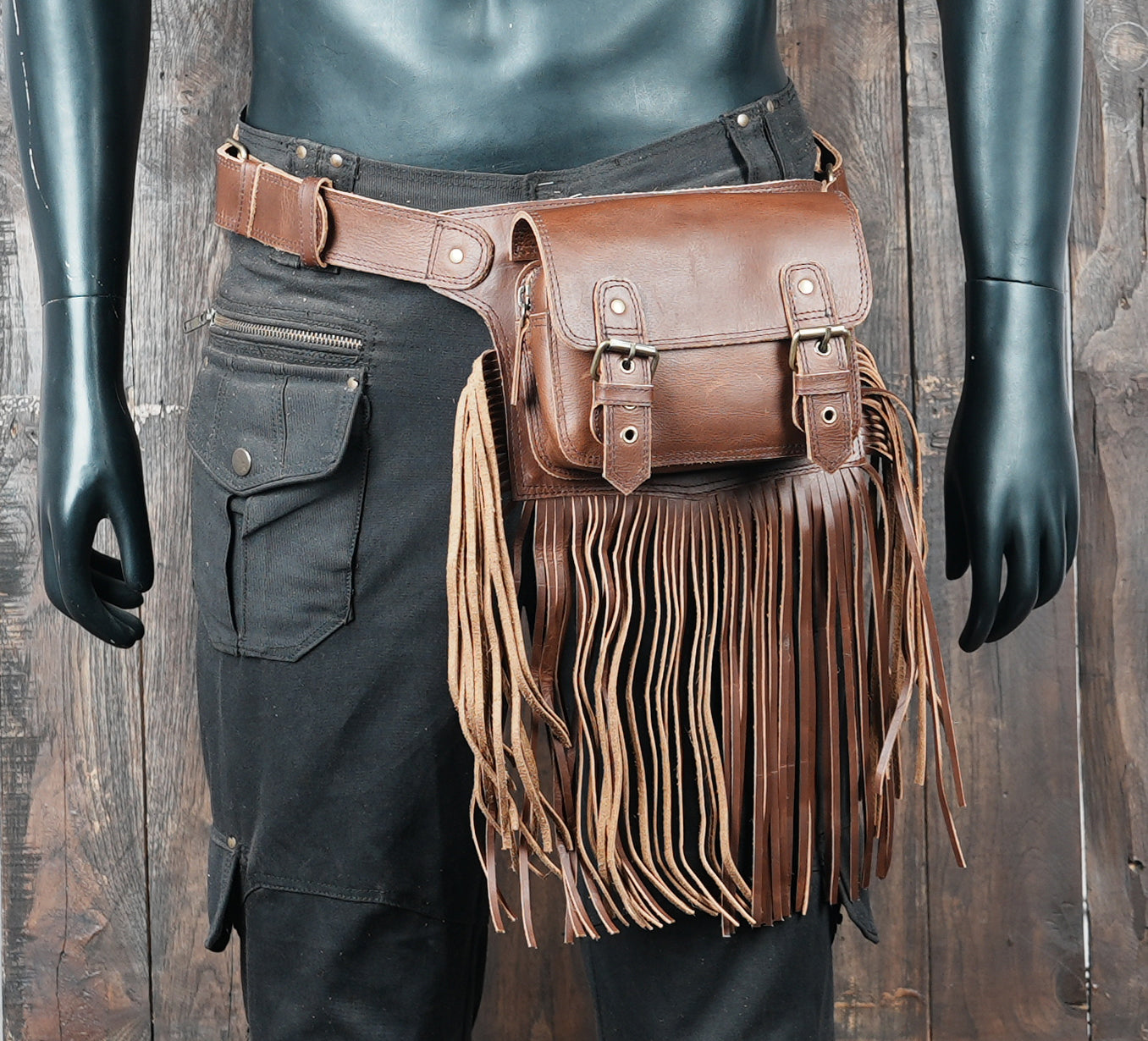 Outdoor adventure leather belt bag with rustic fringe detail