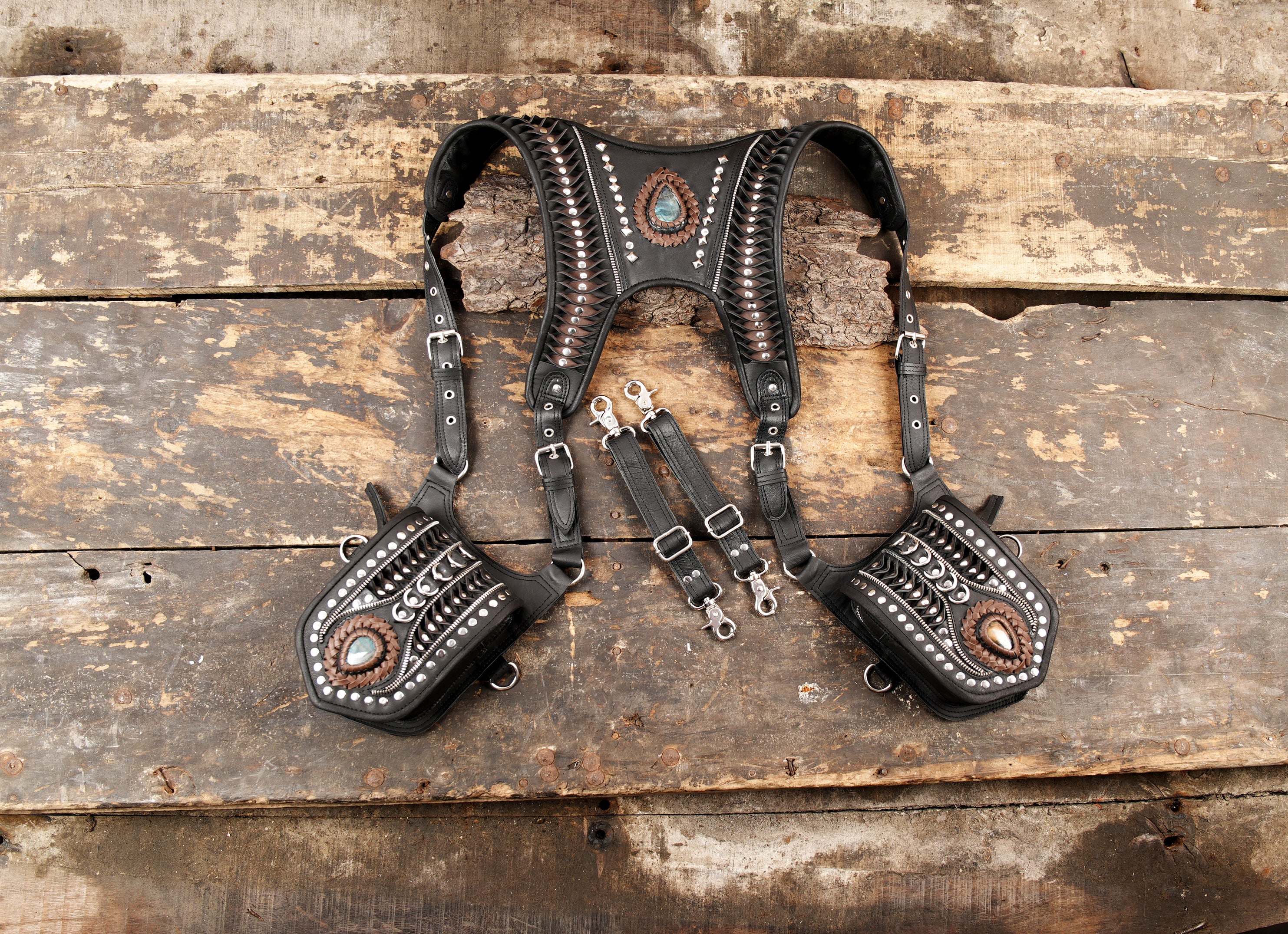 Black leather dual shoulder holster with gemstone accents and silver studs
