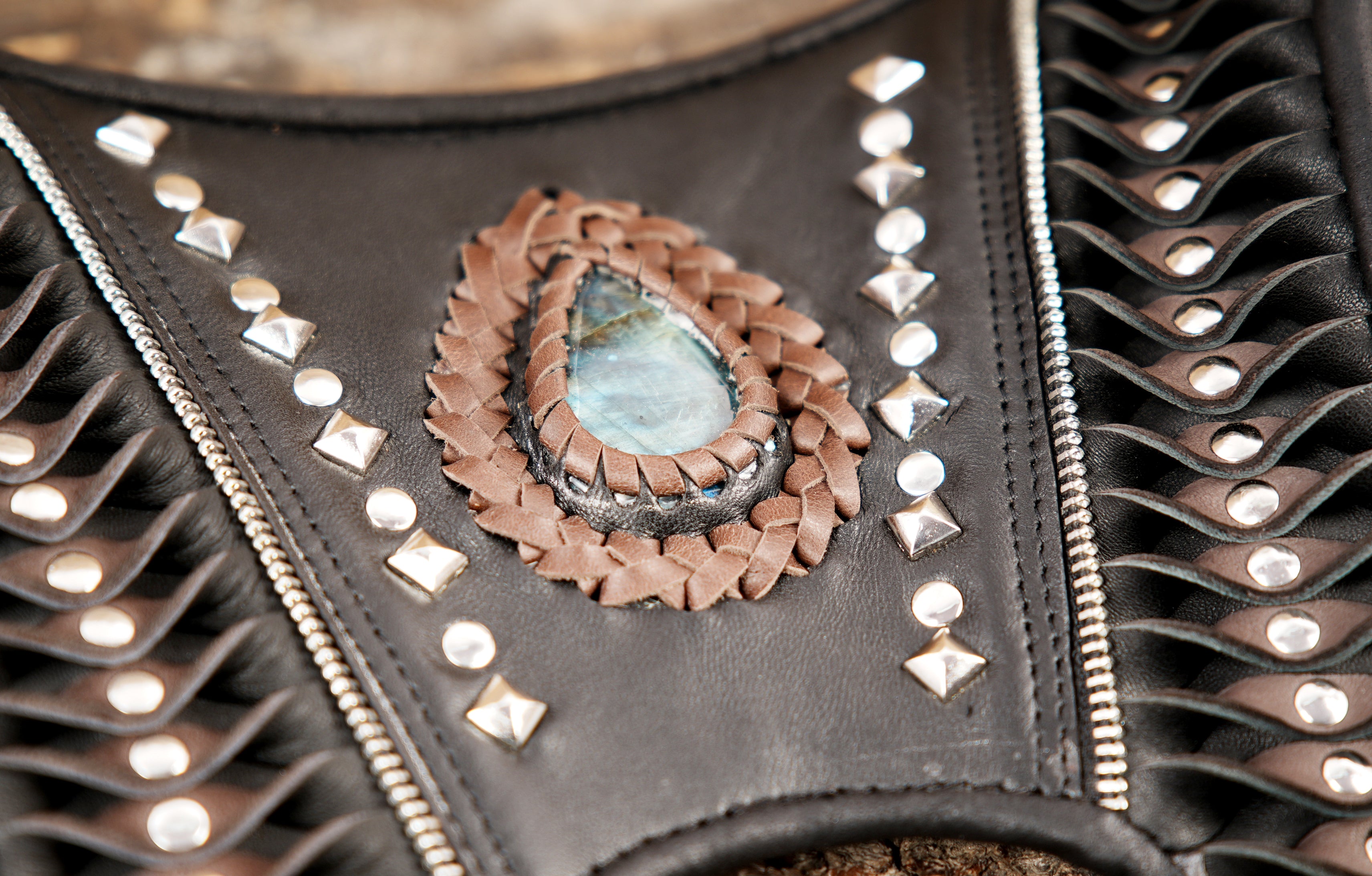 Gothic leather holster with textured panels and gemstone inlay